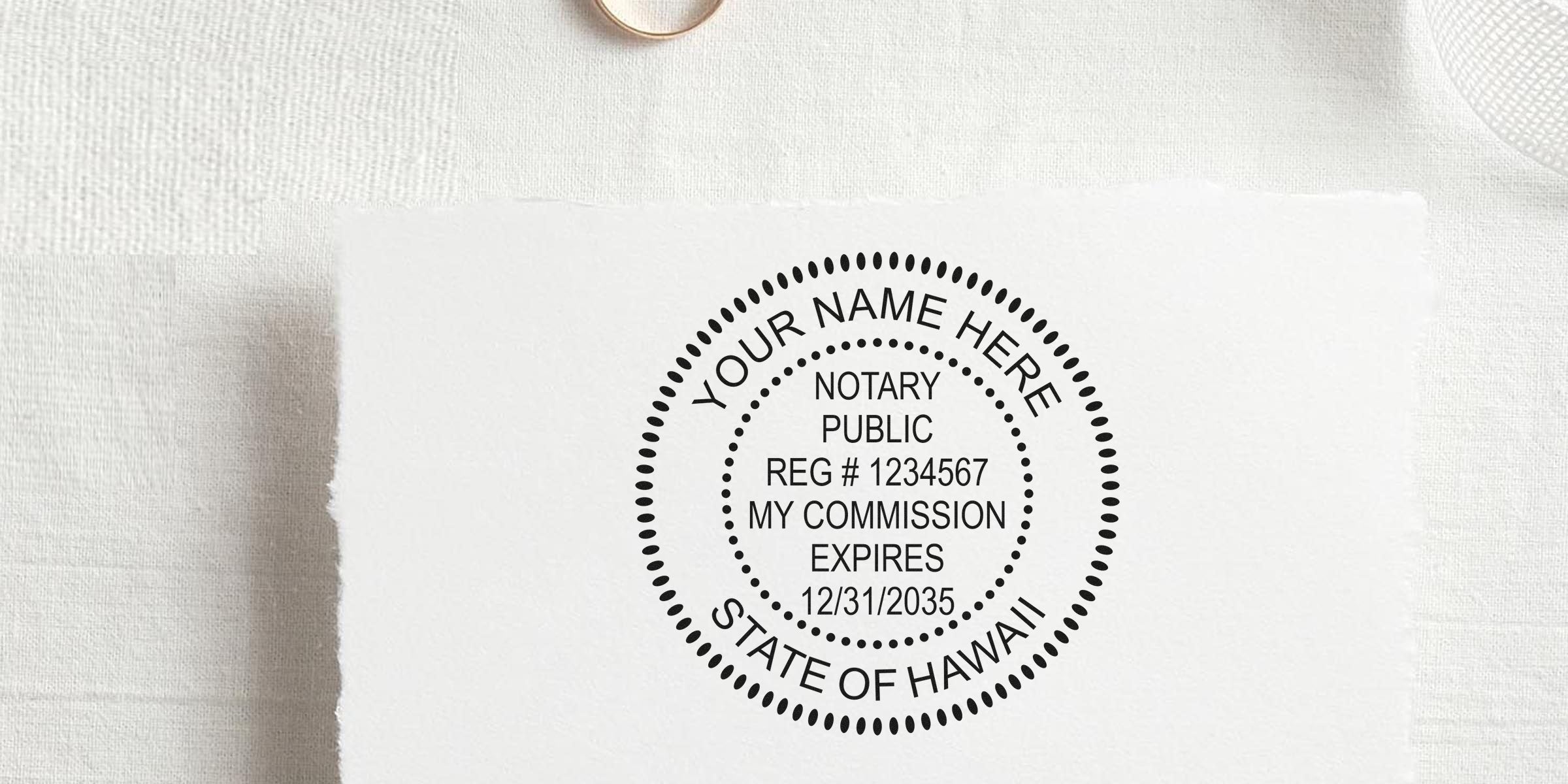Hawaii notary seal stamp with commission expiration date on white paper, a key part of essential Hawaii notary supplies.
