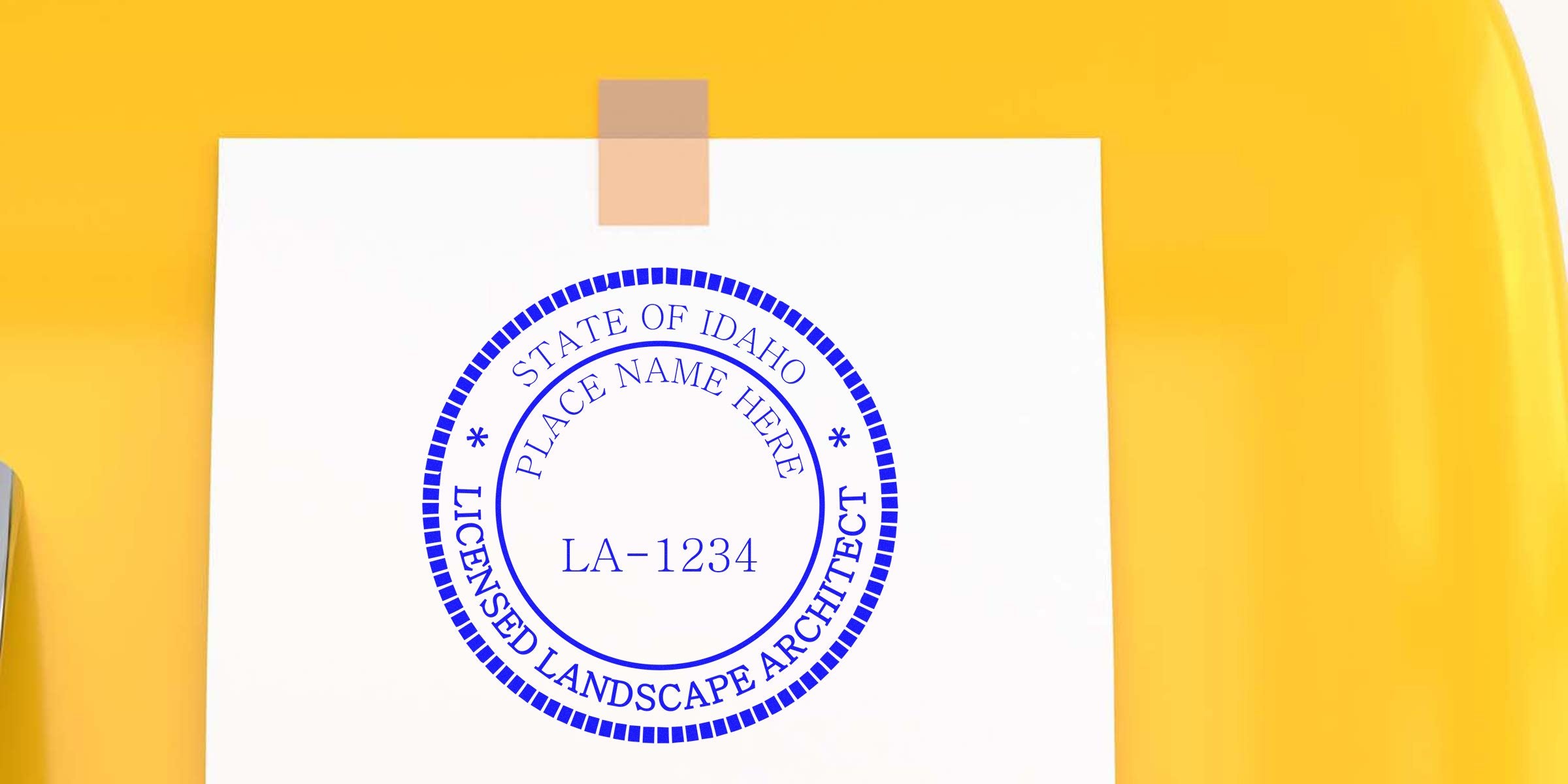Idaho Landscape Architect Stamp with license LA-1234 on white paper, yellow background, showing professional landscape design approval.