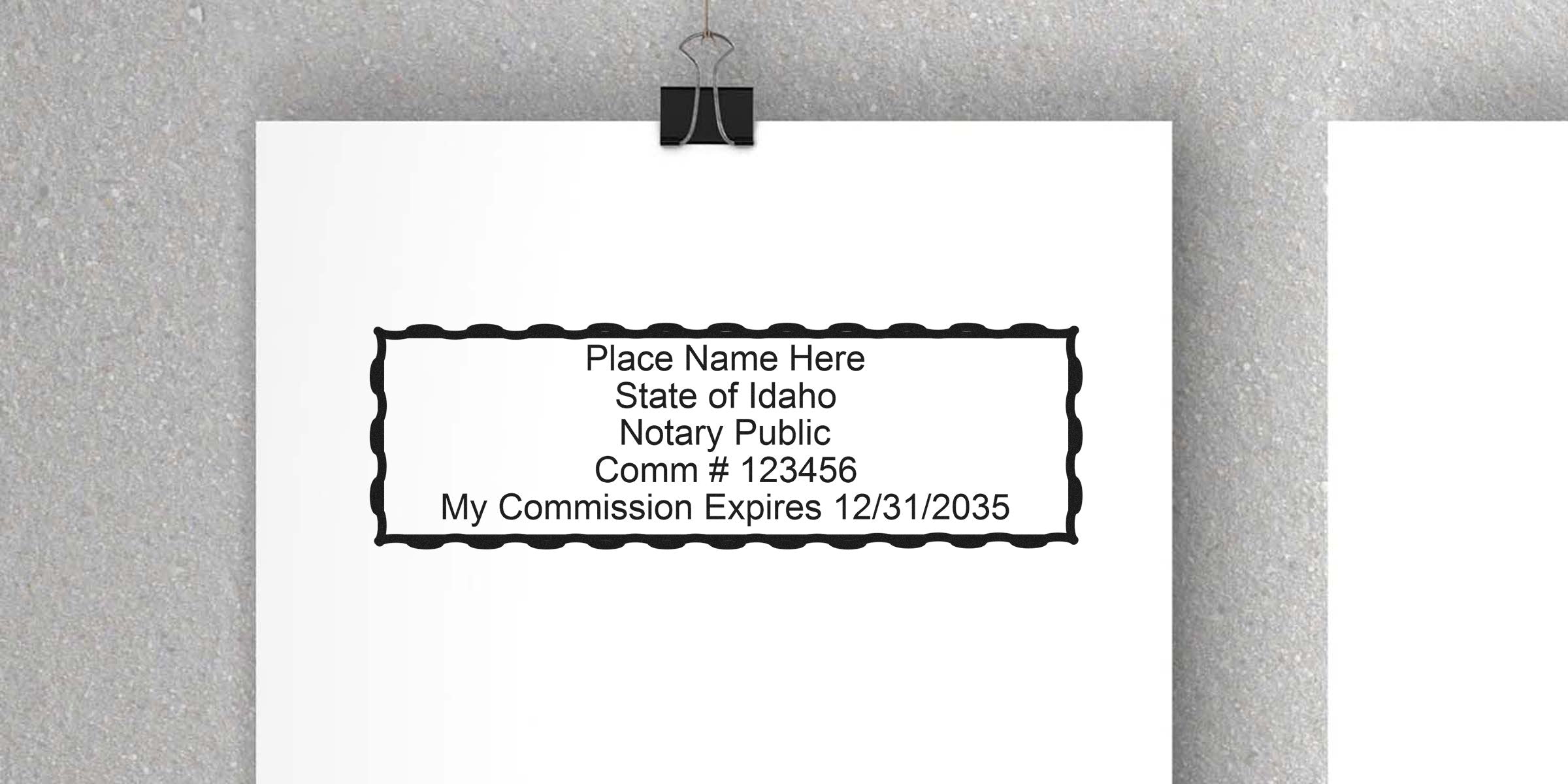 Idaho notary public stamp on white paper with commission number and expiration date, alongside key notary tools and Idaho notary supplies.
