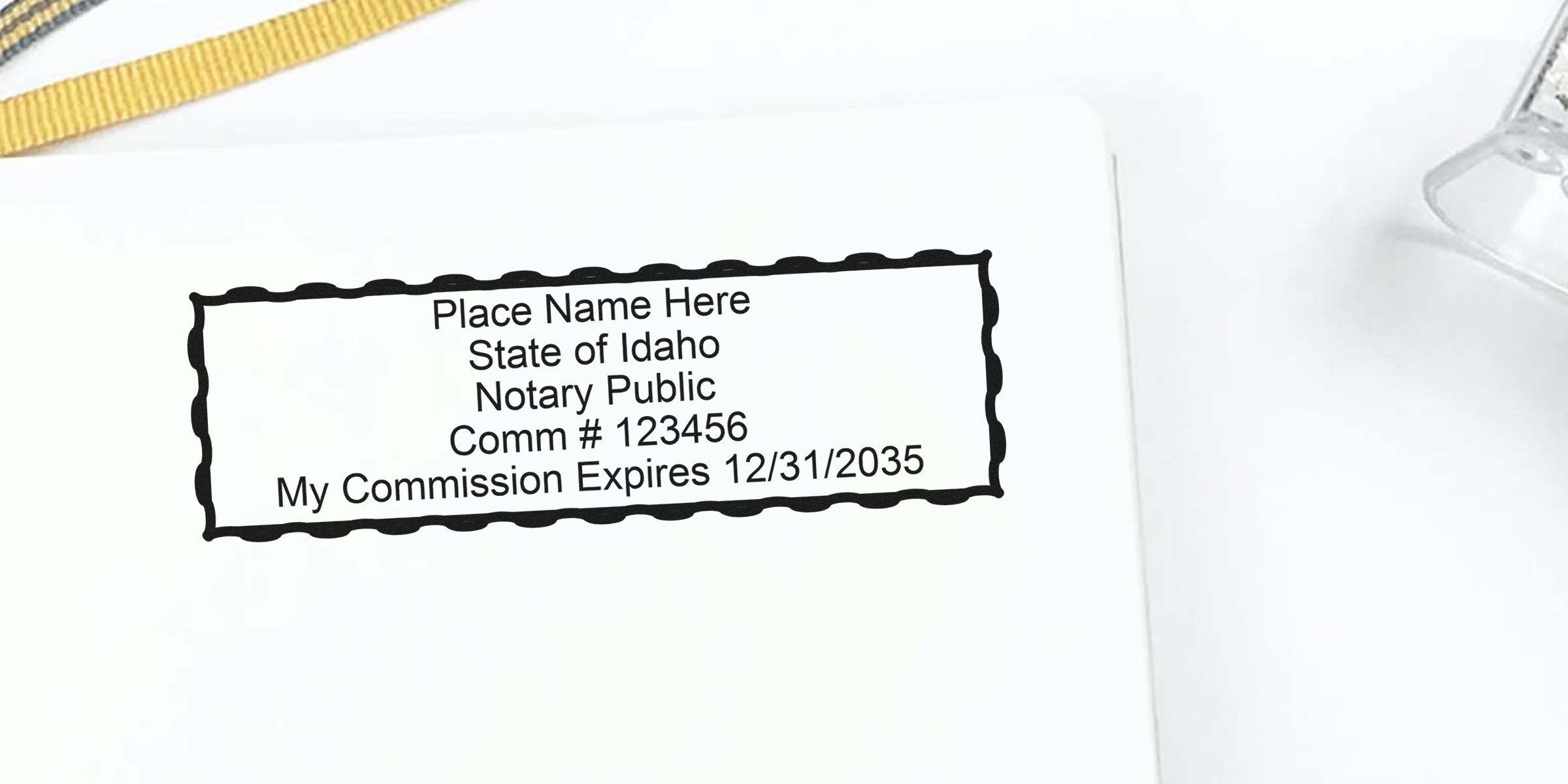 Idaho notary stamp showing commission number and expiration date on white paper, improving notary efficiency.