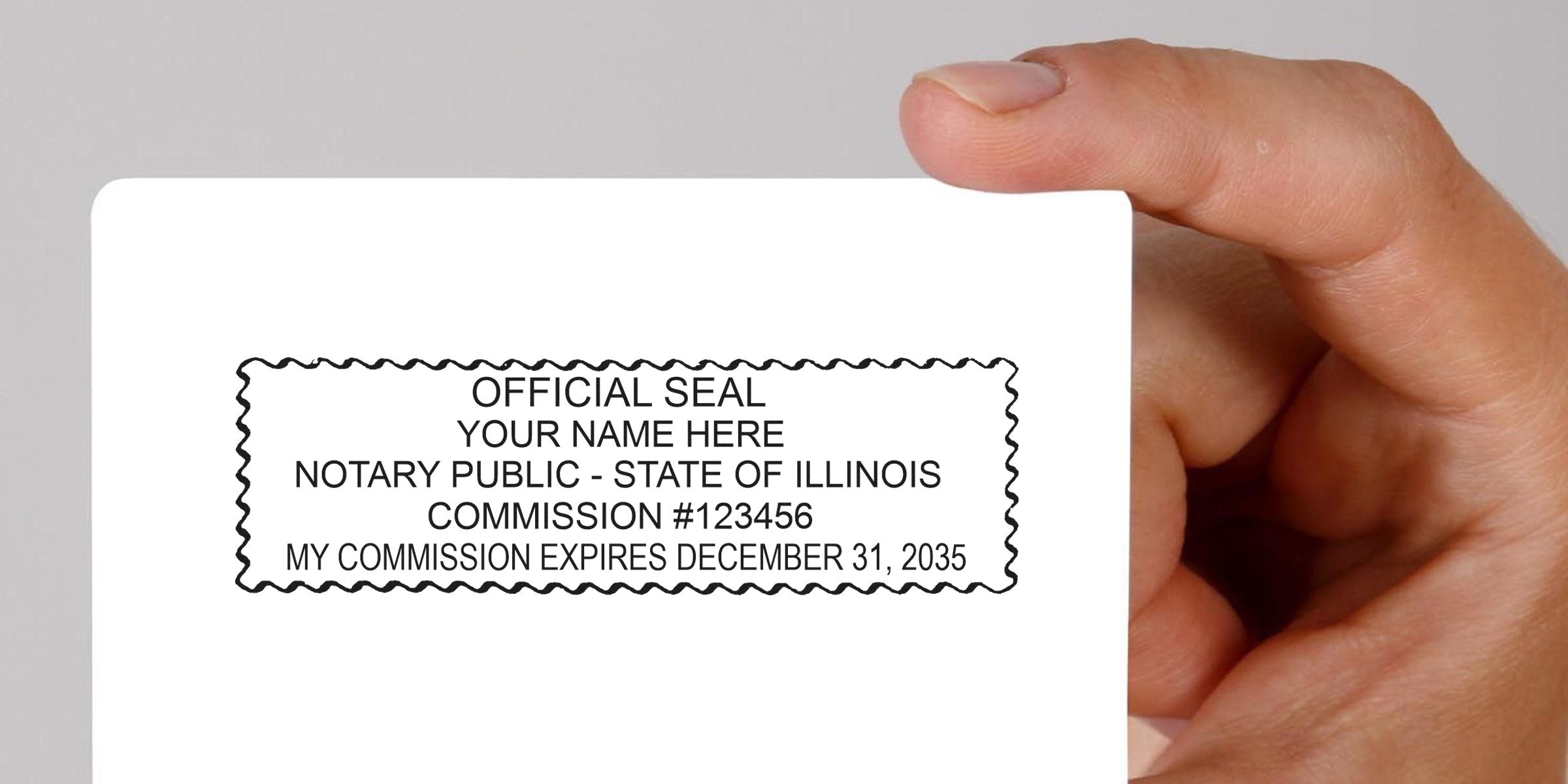 Hand holding Illinois notary seal stamp with official seal and commission expiration date, symbolizing trusted notary services.