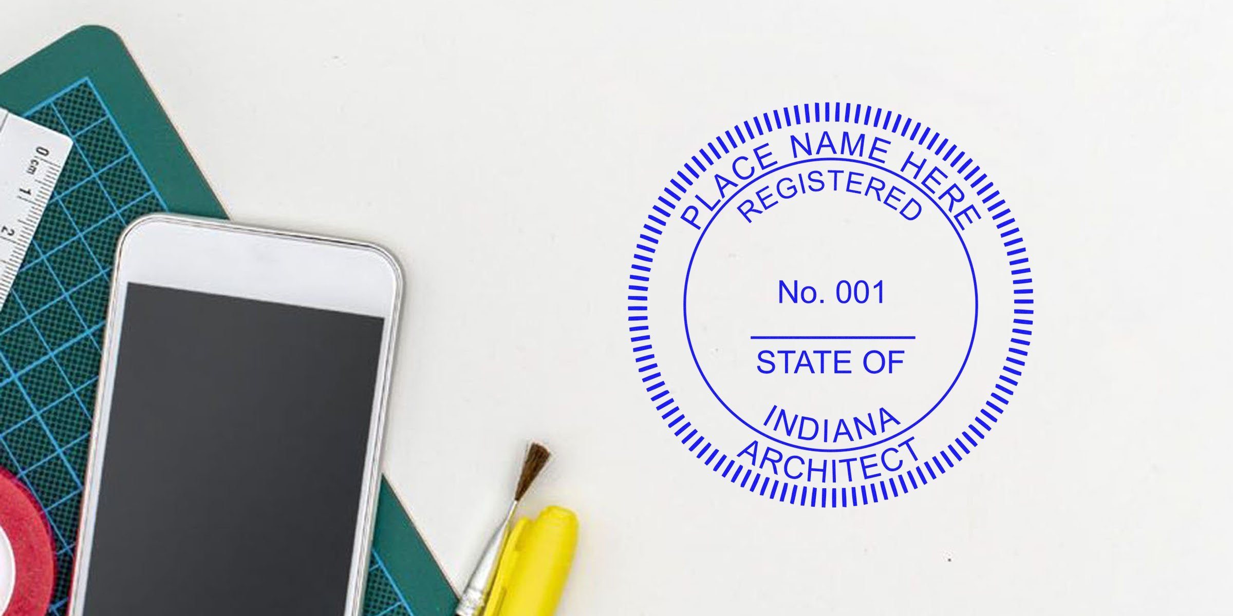 Indiana architect seal stamp on white desk with smartphone and drawing tools, emphasizing Indiana architect stamp laws and seal requirements.