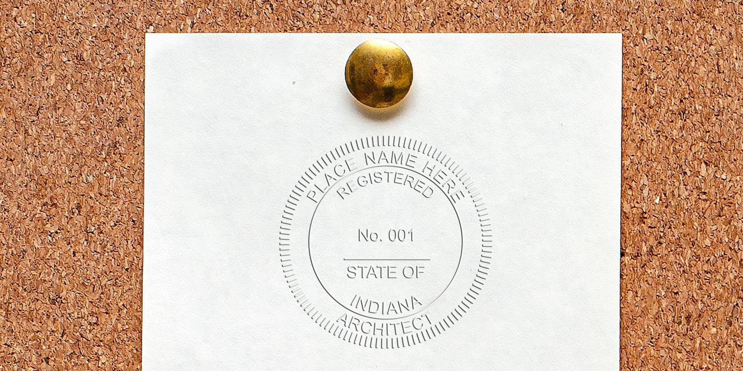 Indiana architect stamp on white paper pinned to cork board, displaying registered architect seal meeting Indiana's seal requirements.