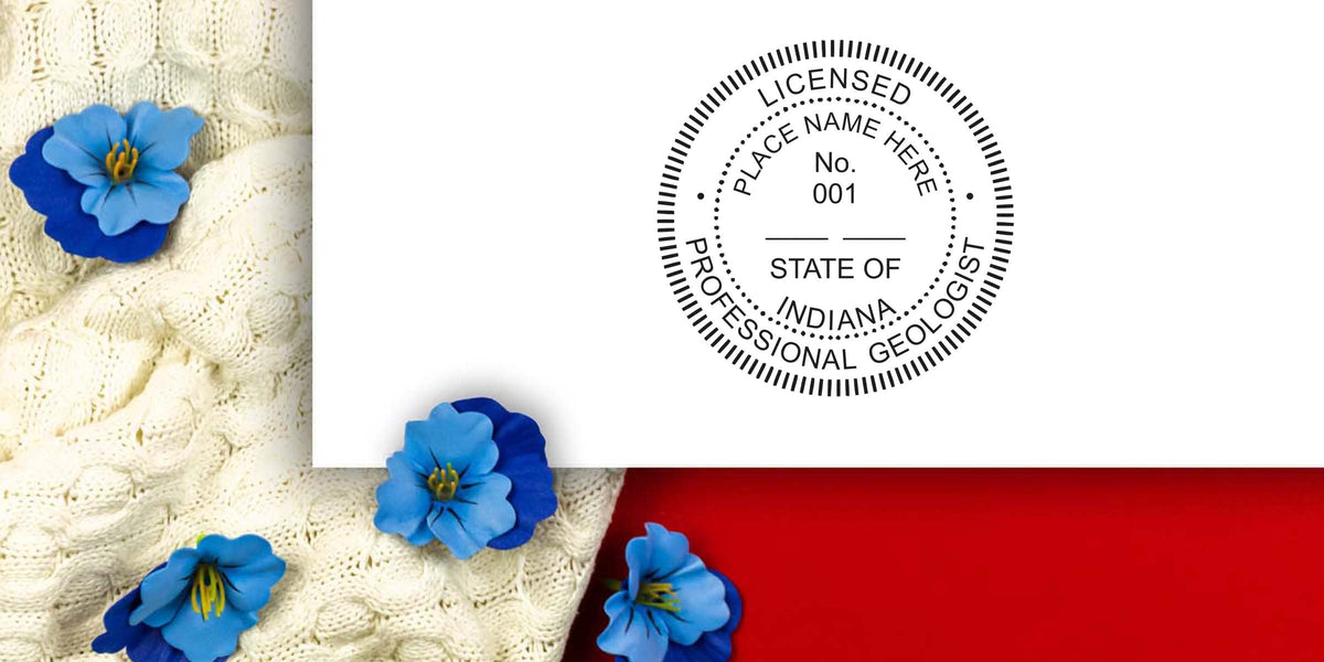 Indiana geologist stamp on white paper with blue flowers, placed on cream knitted fabric and red background, following Indiana geologist stamp guidelines.