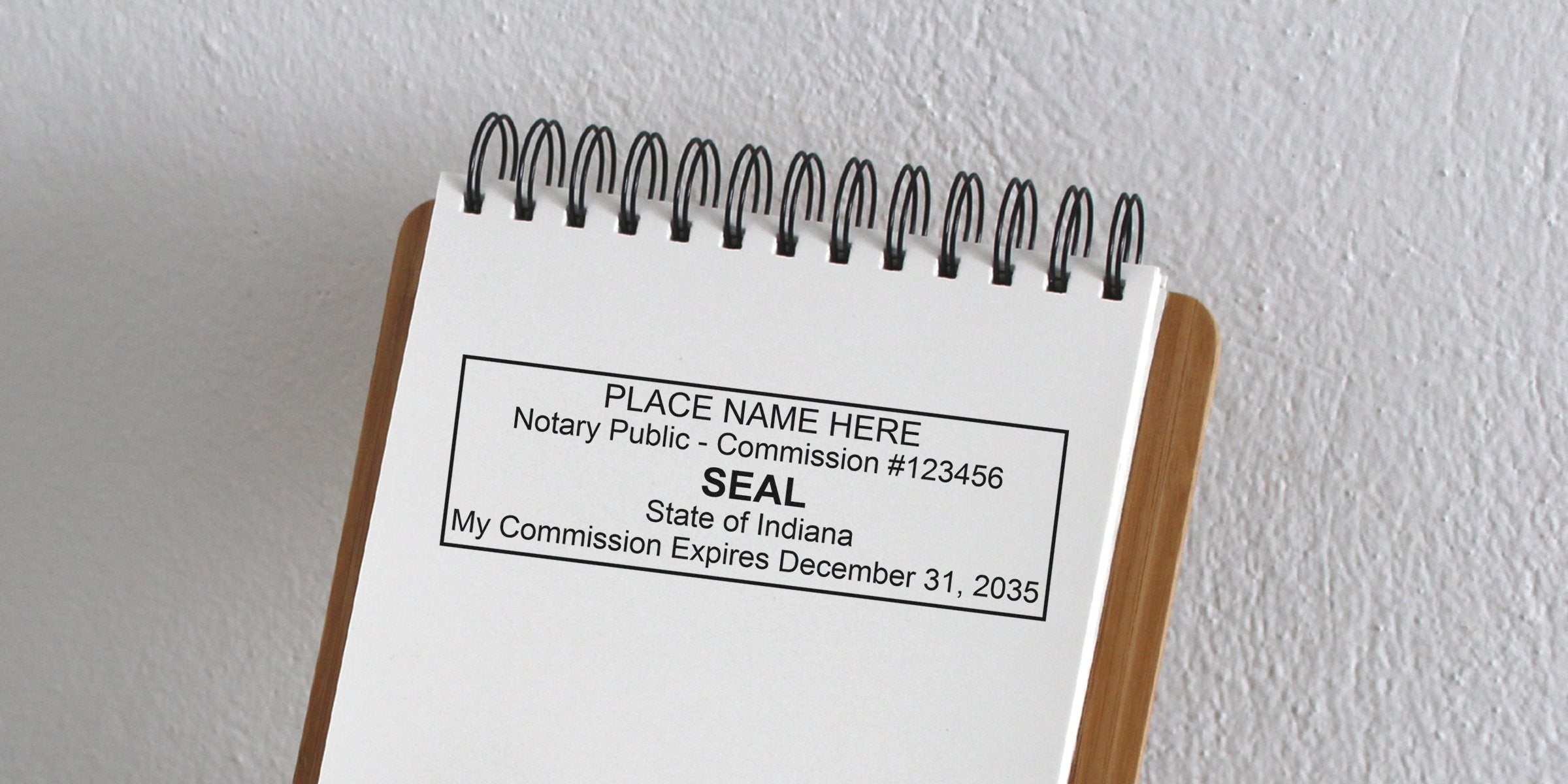 Indiana notary stamp on white paper displaying commission number and expiration date, complying with Indiana notary stamp requirements.