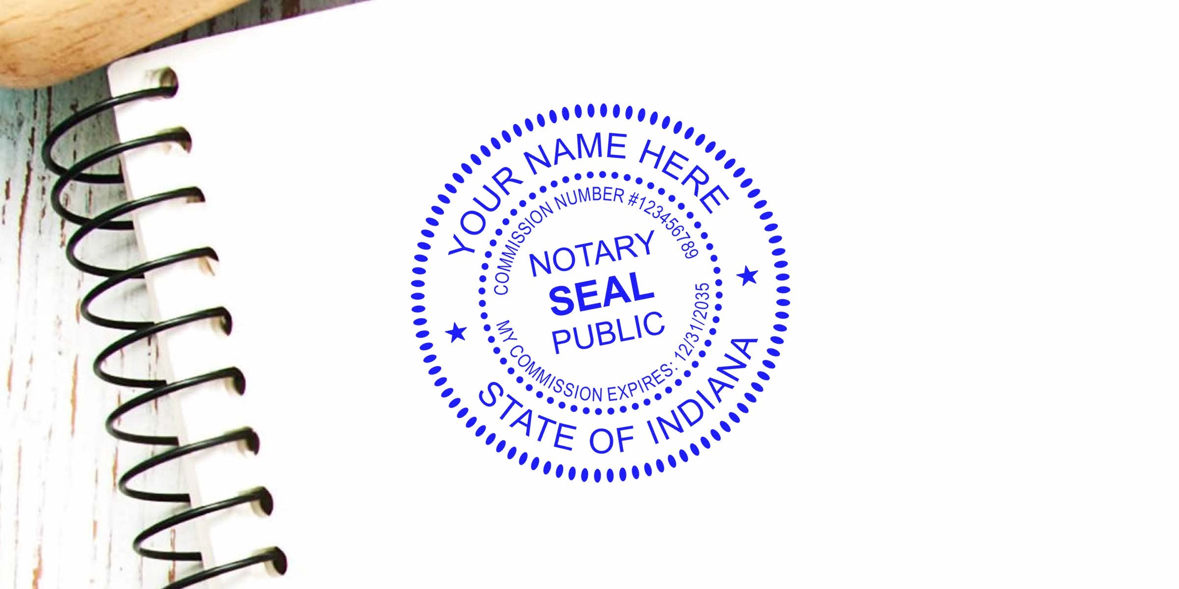 Blue Indiana notary stamp on white paper with spiral notebook, showing Indiana notary public commission seal, perfect for online Indiana notary stamps.