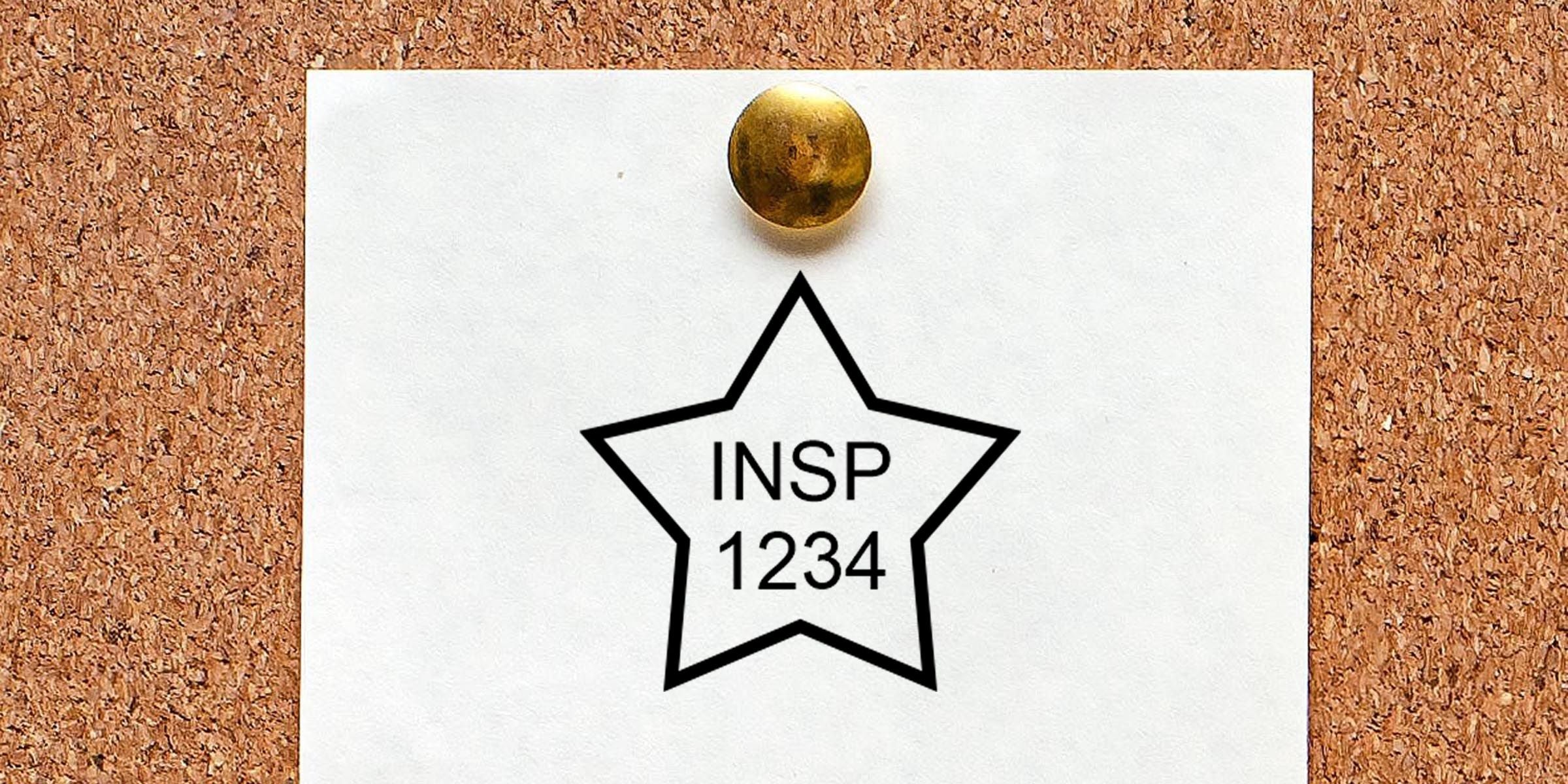 White note pinned to a corkboard with a star outline and the text “INSP 1234” in the center