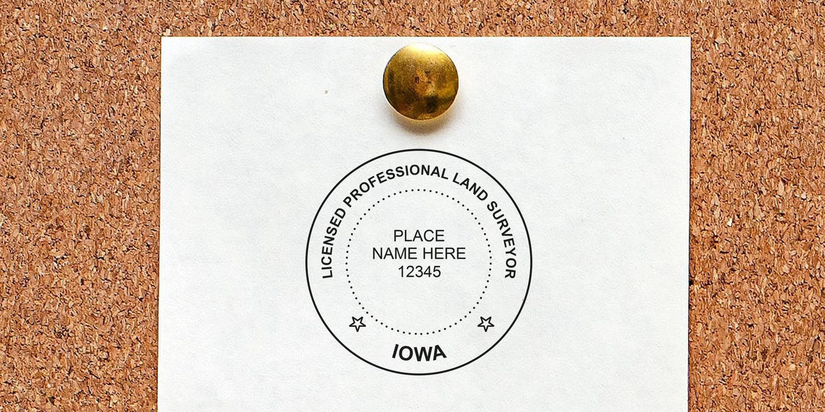 Iowa land surveyor stamp on cork board, symbolizing a licensed professional land surveyor in Iowa.