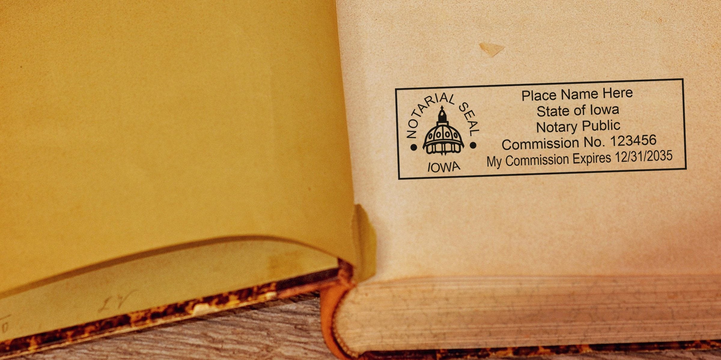 Iowa notary stamp with commission number and expiration date on an old book page, showing a self-inking notary stamp design.