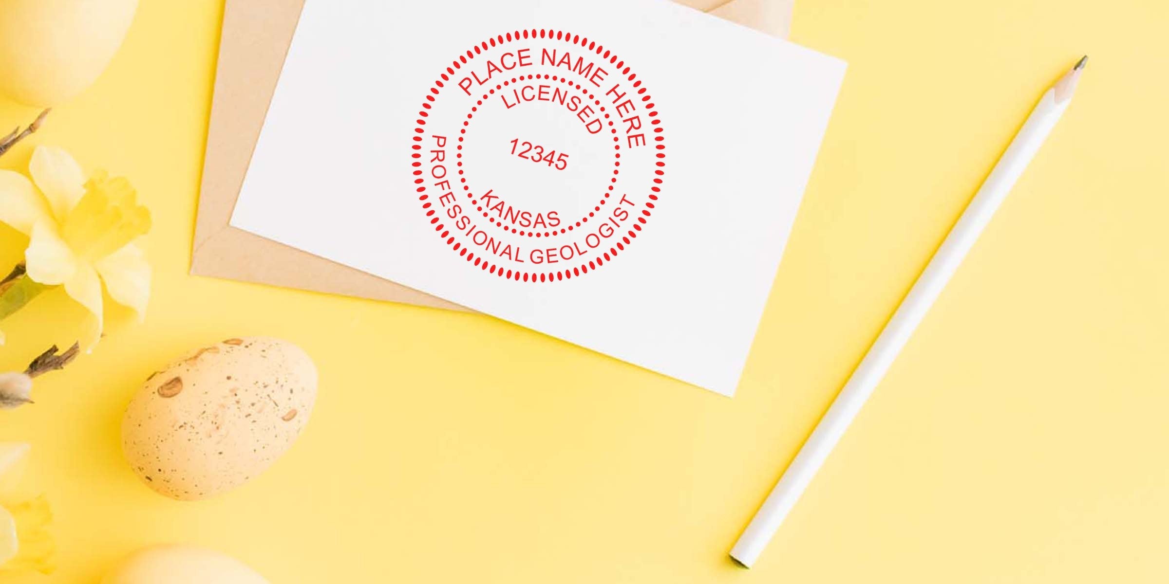 Kansas Geologist stamp on white card with pencil and spring flowers on yellow background, showing licensed professional geologist stamp and size tips.