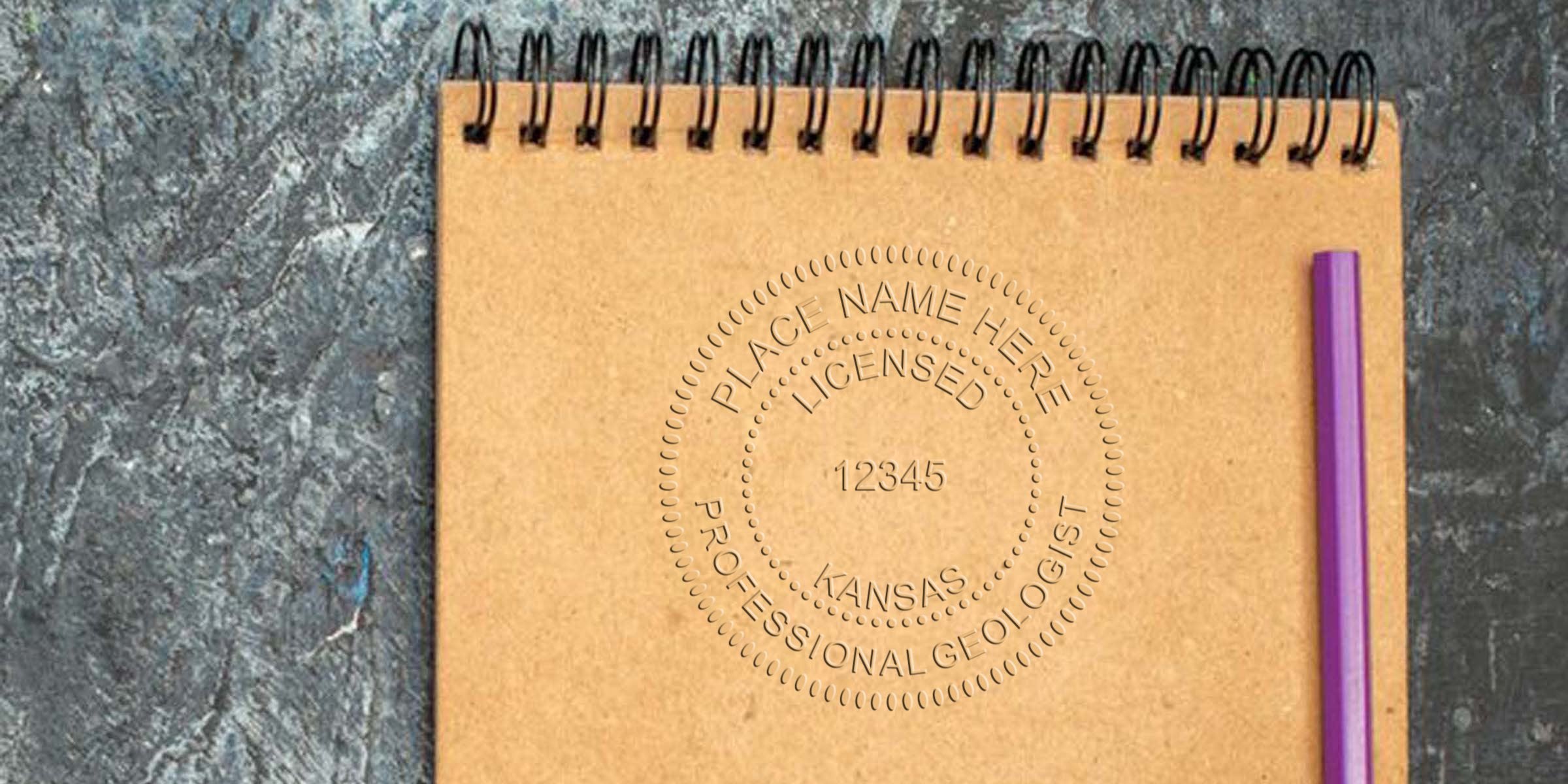 Spiral notebook with purple pen on textured stone, showing Kansas Geologist Stamp and stamp collecting tips for professional geology notes.