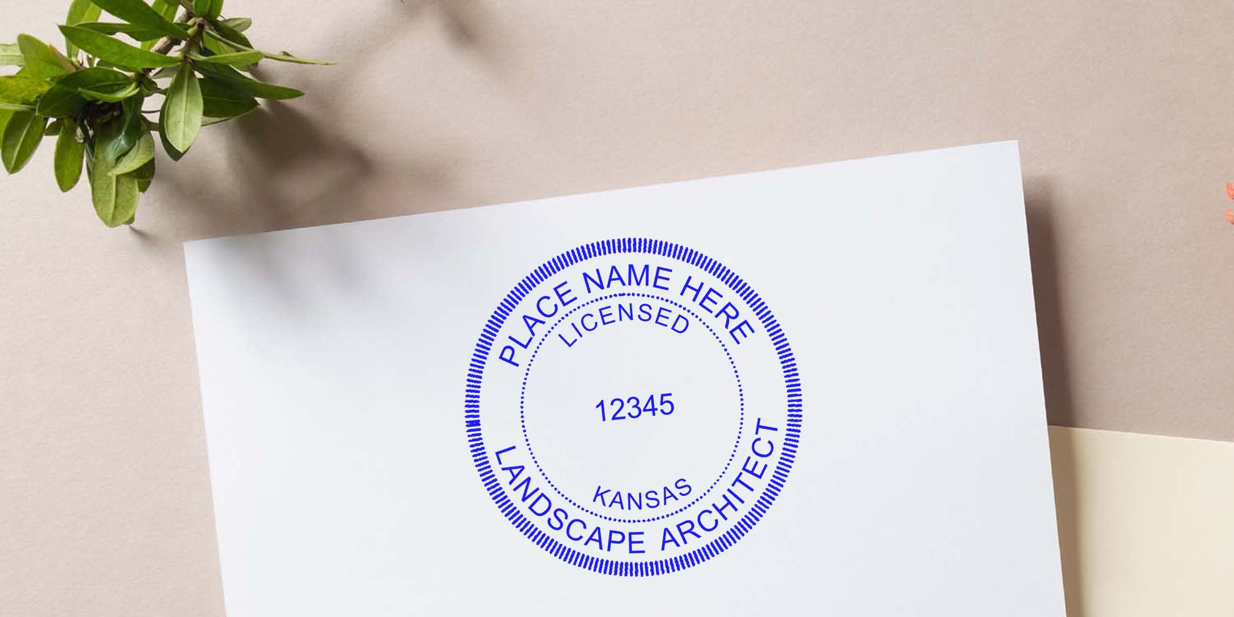 Kansas landscape architect seal stamped on white paper, surrounded by green leaves.