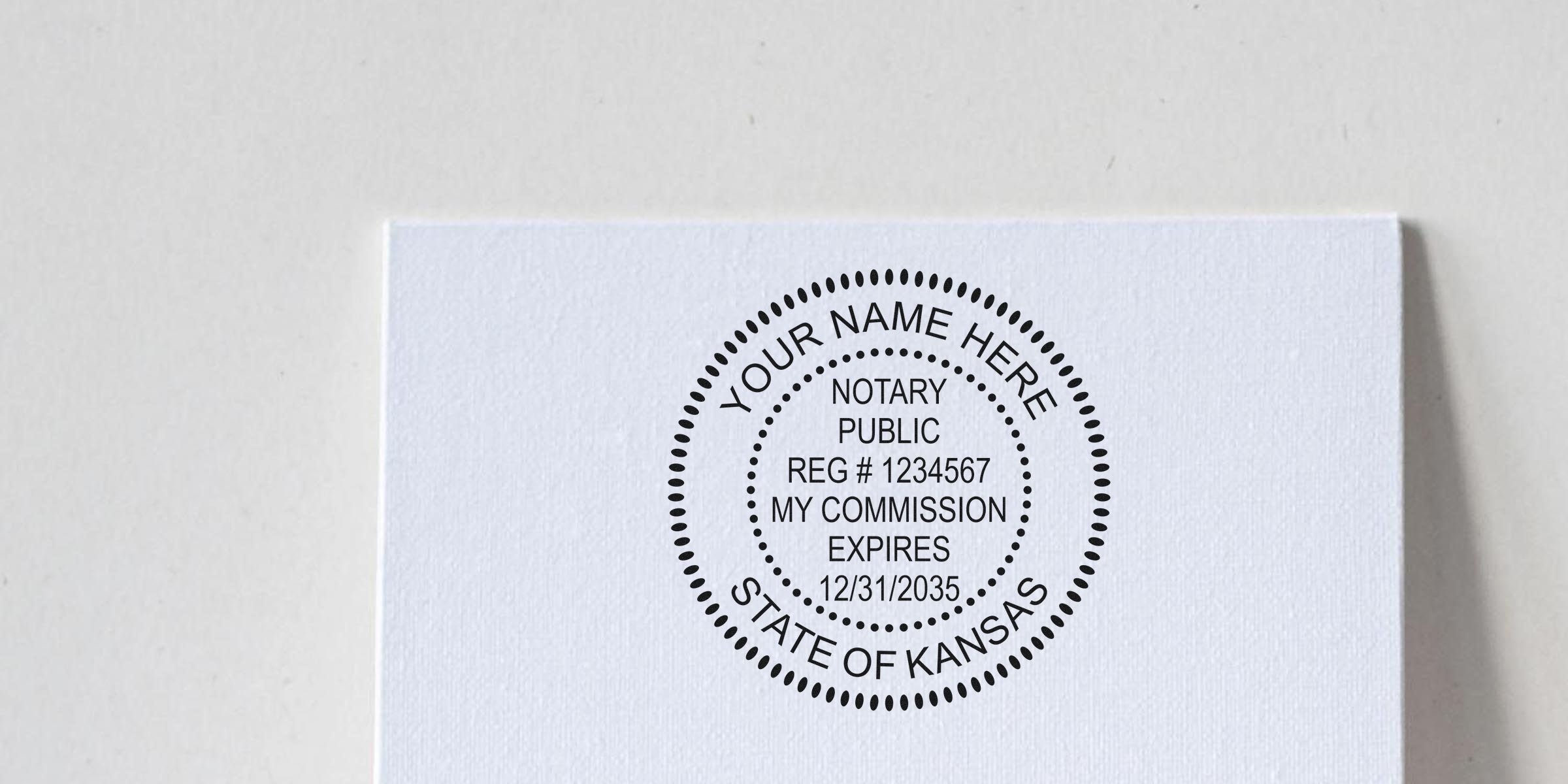 Kansas notary stamp on white paper shows commission expiration date, highlighting common Kansas notary and supply errors.