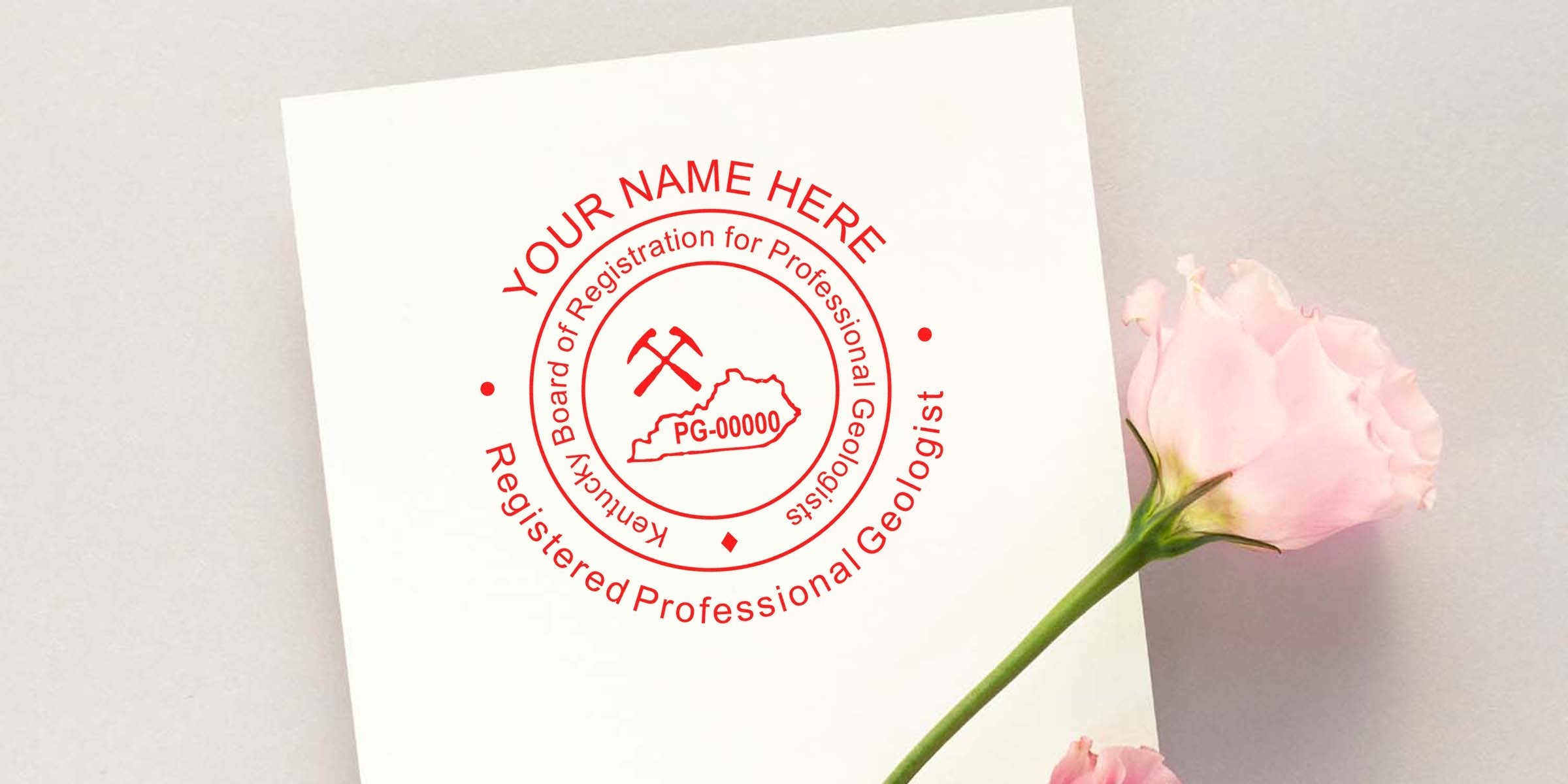 Kentucky Professional Geologist Seal with mining tools and state outline on white paper next to a pink rose, symbolizing Kentucky Geologist Licensing.