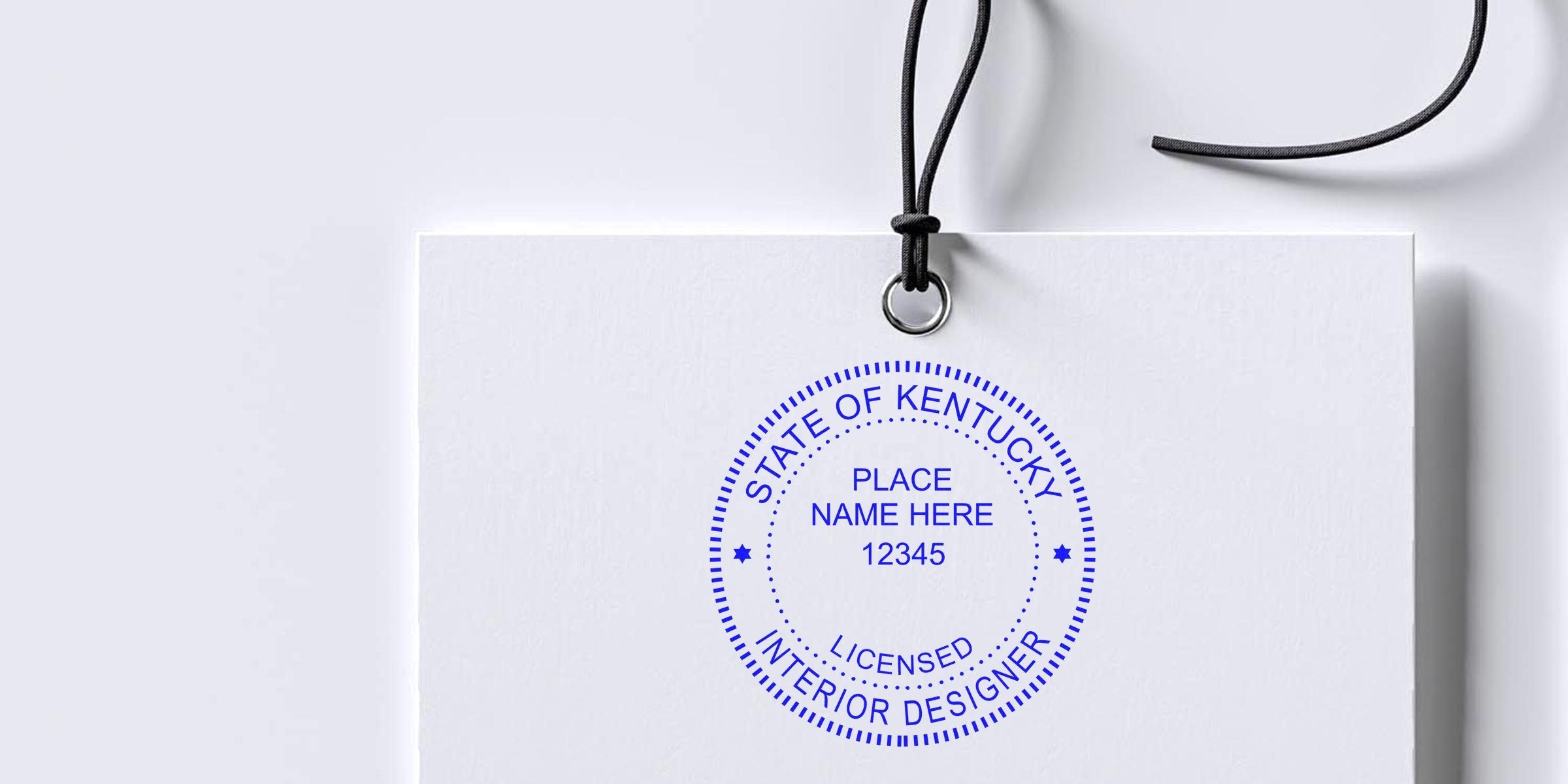 Kentucky licensed interior designer stamp on white paper tag with black string, highlighting costs and fees for interior design stamps in Kentucky.