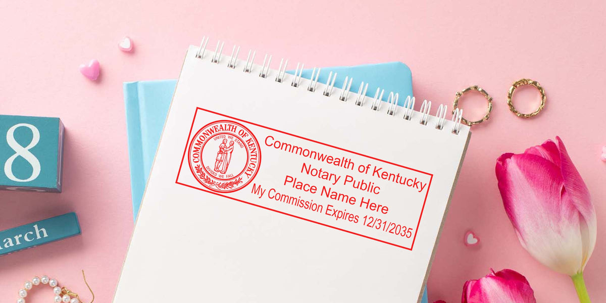 Kentucky notary stamp on a notebook with pink tulips and a March calendar block, showing Kentucky notary seal requirements.