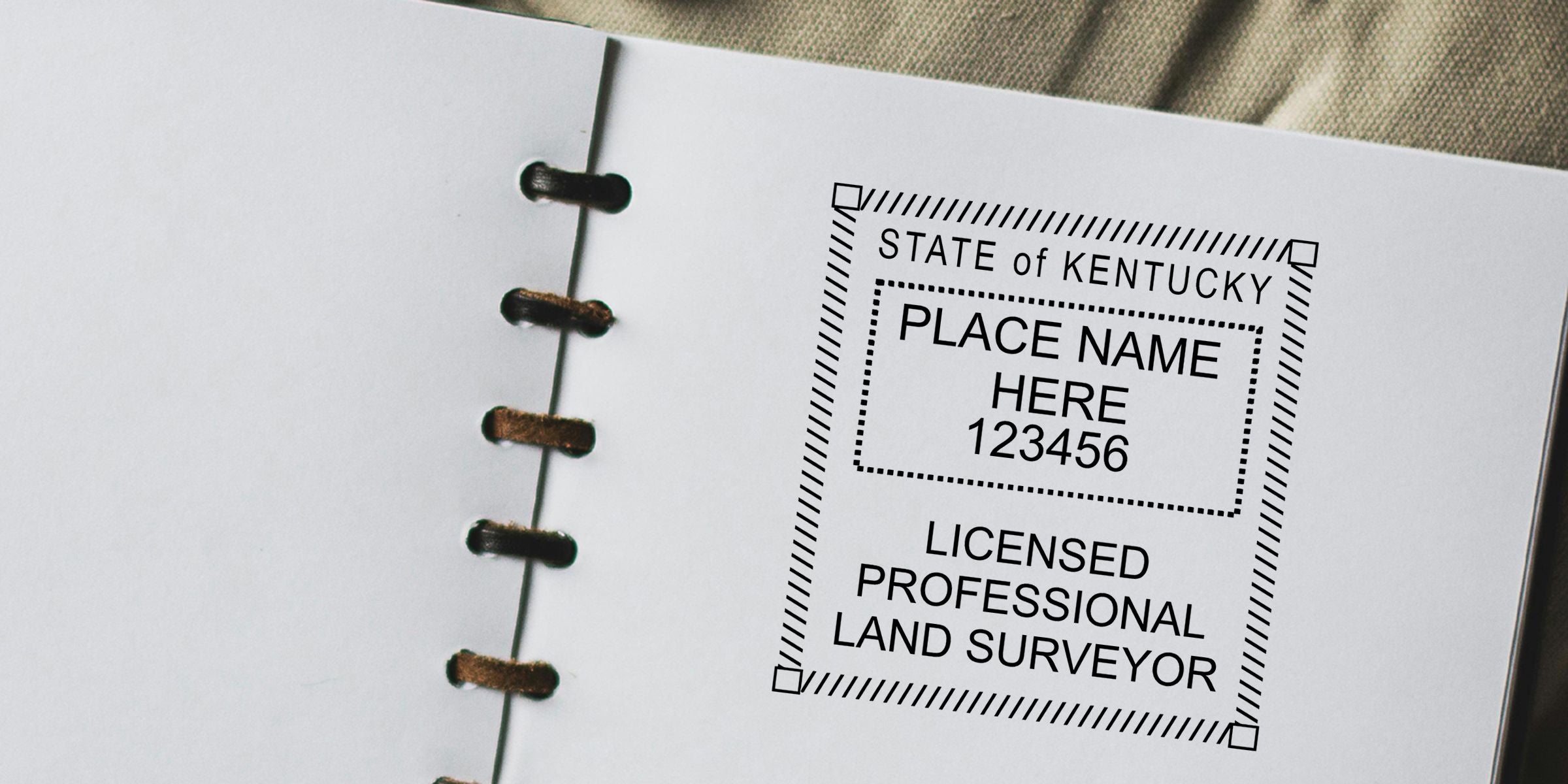 Kentucky licensed professional land surveyor stamp on a white binder page with place name and license number placeholder