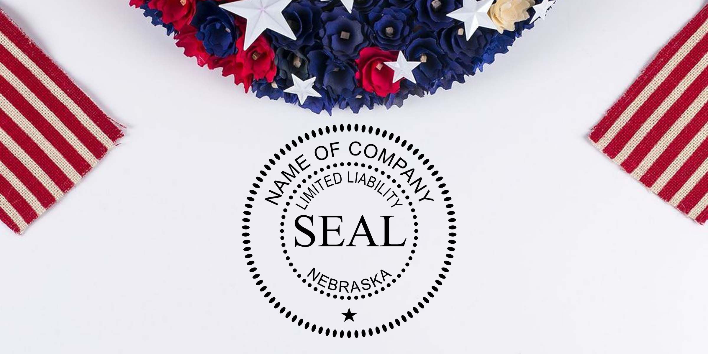 Nebraska company seal with patriotic red, white, and blue floral wreath and striped ribbon accents on a white background