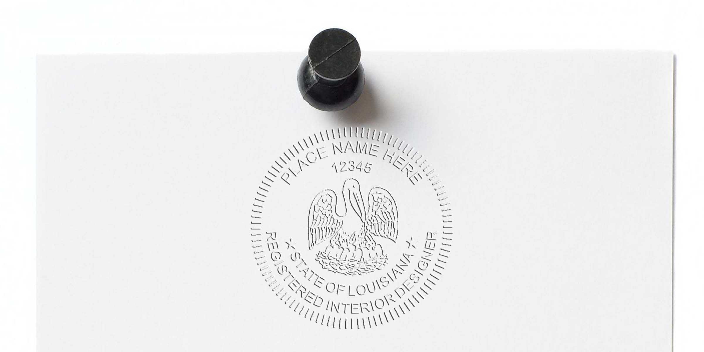 Louisiana interior designer stamp embossed on white paper with black thumbtack, showing design compliance requirements.