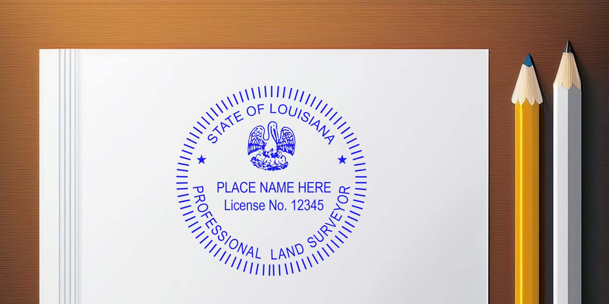 Louisiana land surveyor stamp with license number on white paper next to pencils, made by a trusted surveyor stamp maker.