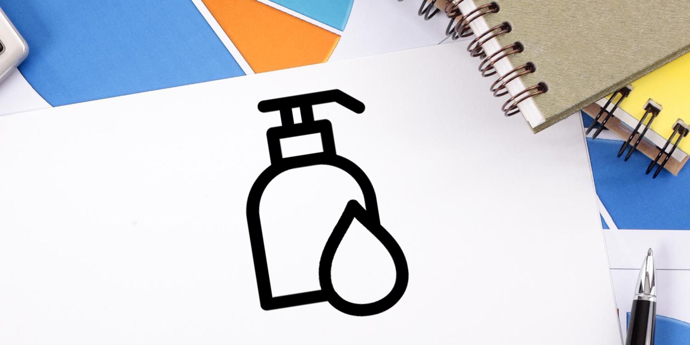 Black soap dispenser and droplet icon on white paper with colorful notebooks, pen, and stationery