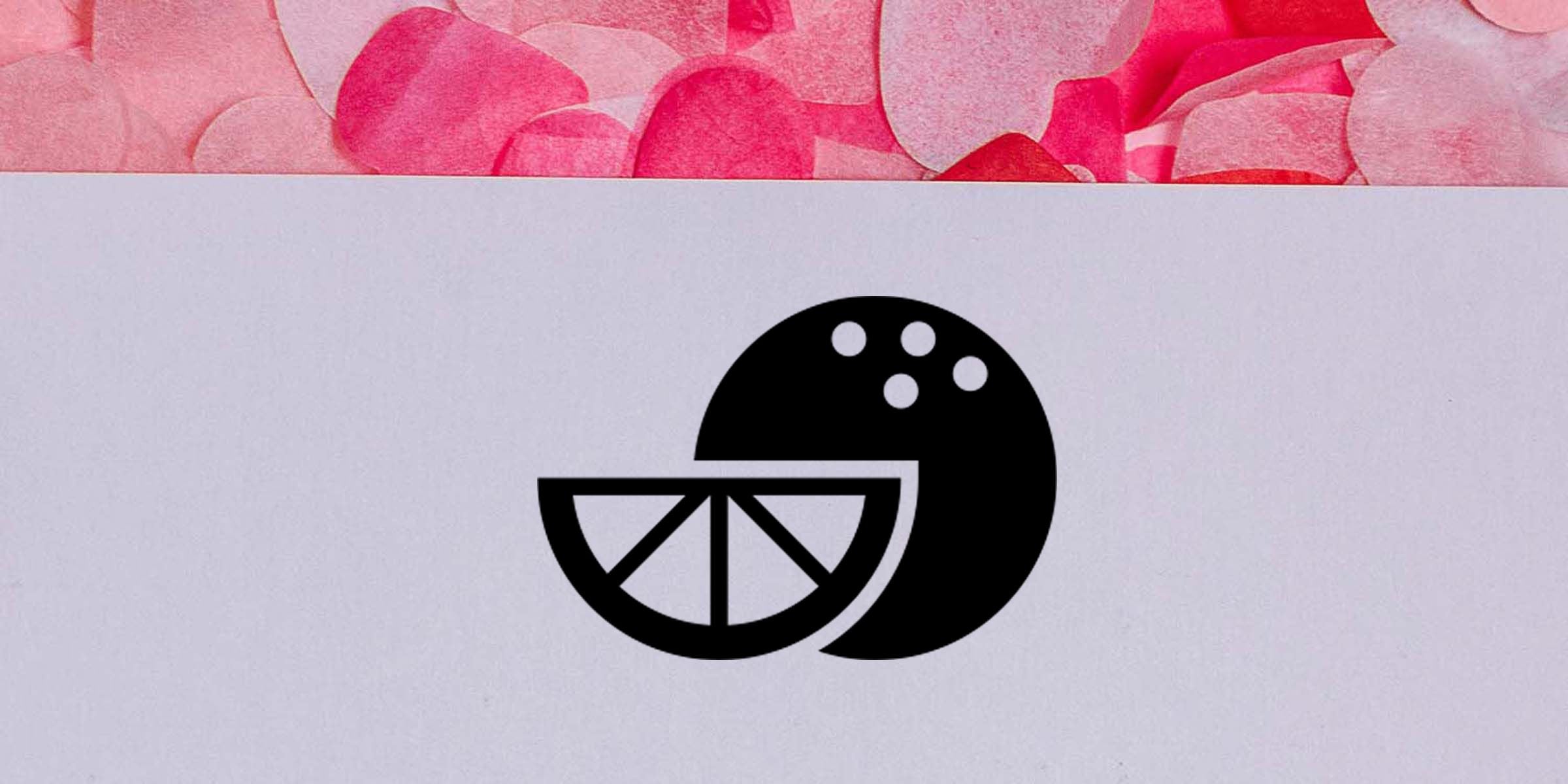 Abstract black lemon slice logo on a white background with pink floral accents at the top