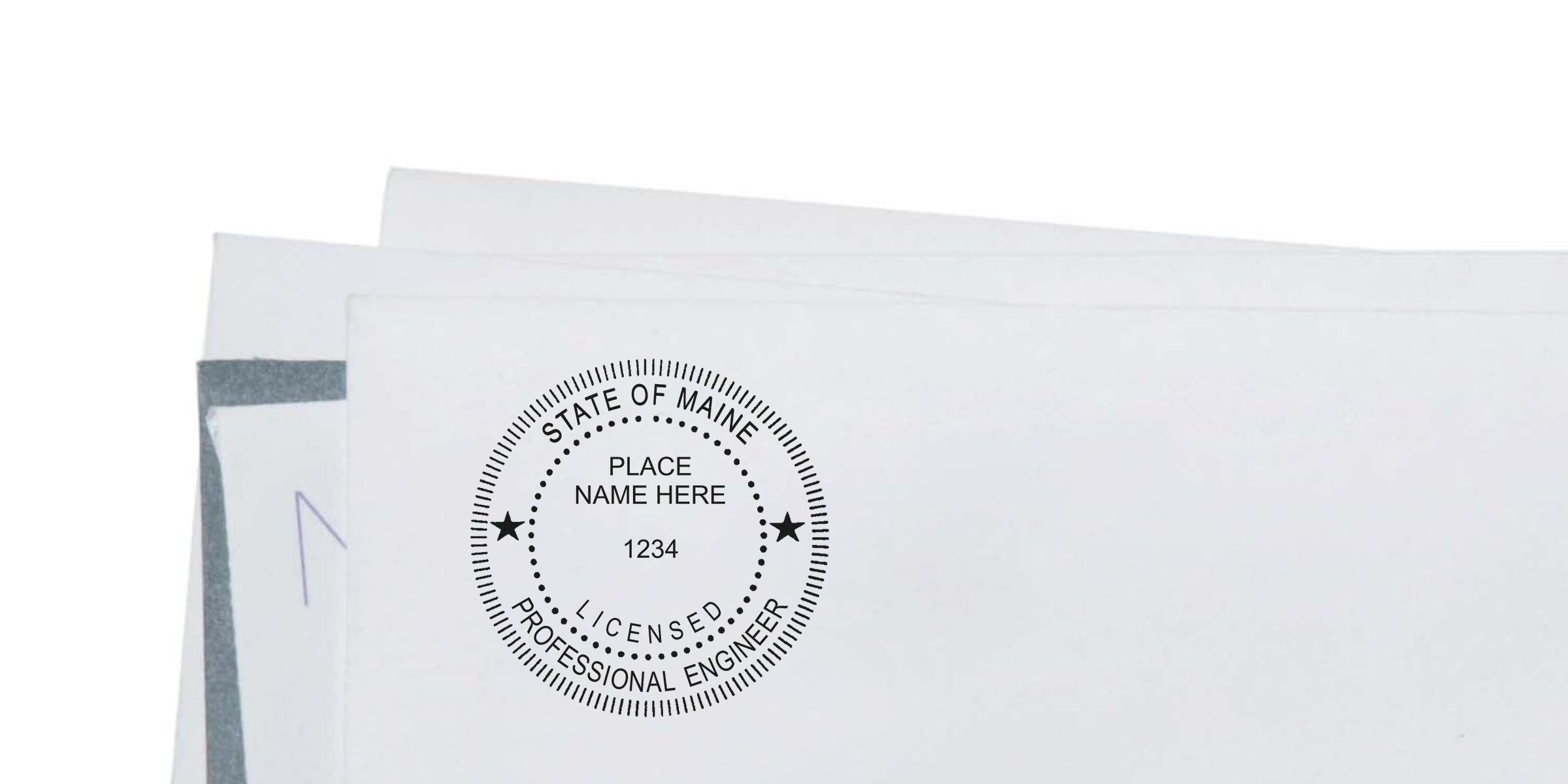 Stack of white papers topped with a State of Maine Professional Engineer stamp on the top document.