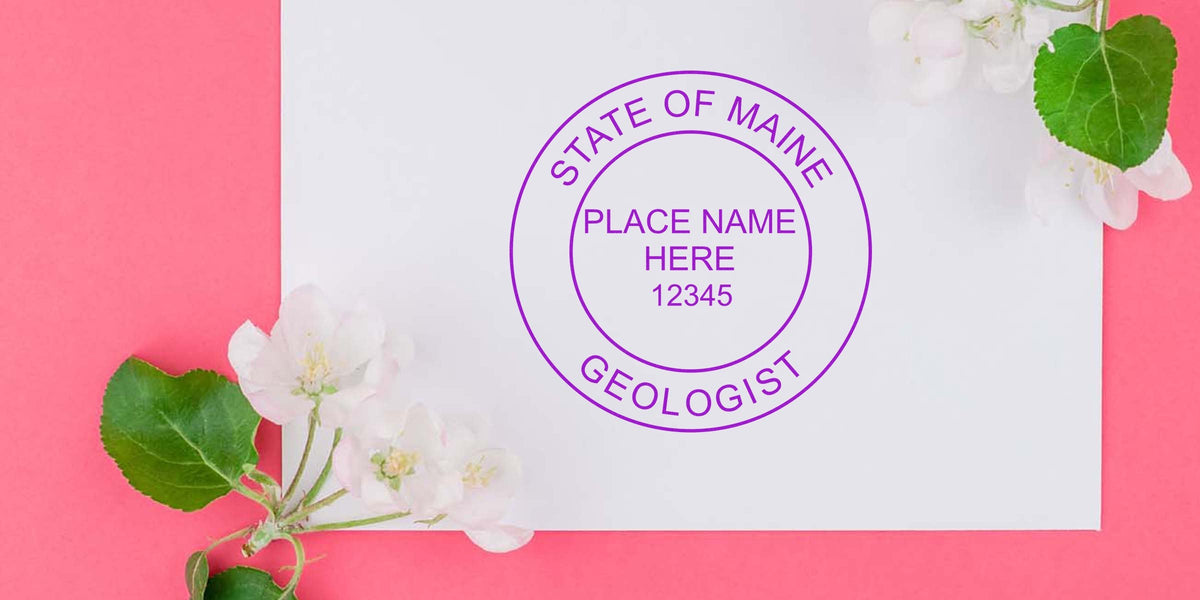 Maine State Geologist Seal on white paper, surrounded by flowers on a pink background, highlighting geological treasures.