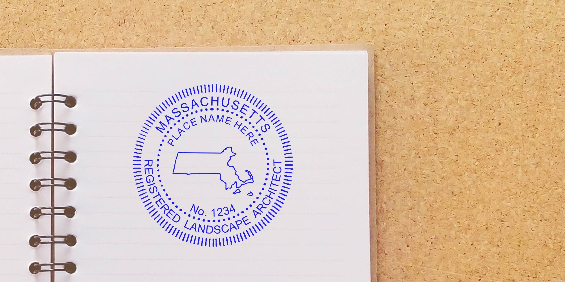 Massachusetts landscape architect stamp on notebook with corkboard, alongside Maine landscape architect seal and stamp.