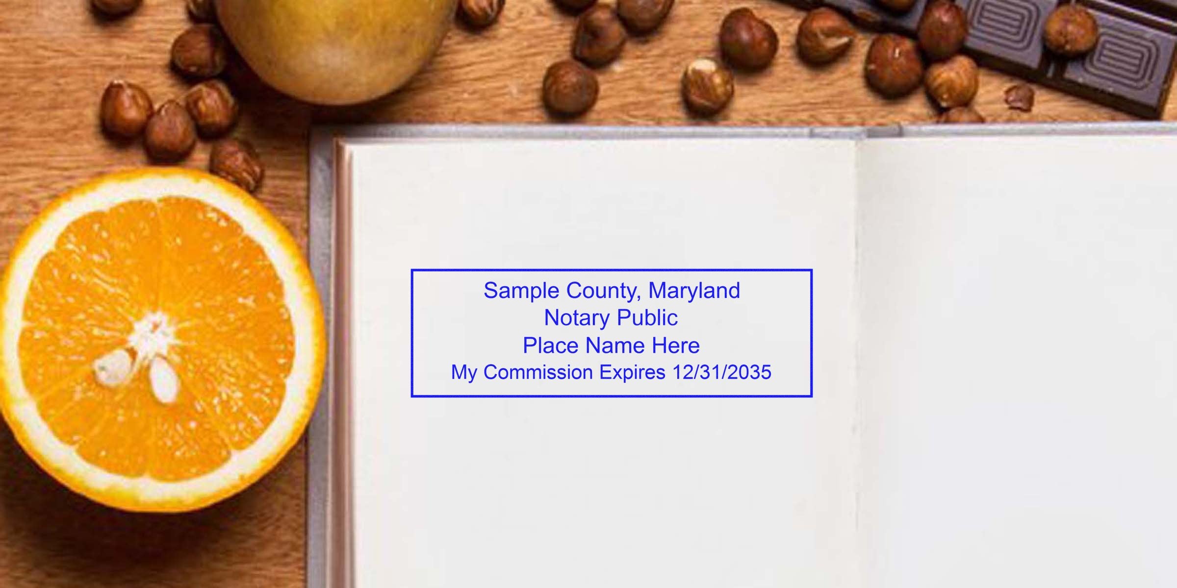 Open notebook with Maryland notary stamp and seal, alongside an orange slice, hazelnuts, and chocolate on a wooden table for Maryland notary public services.