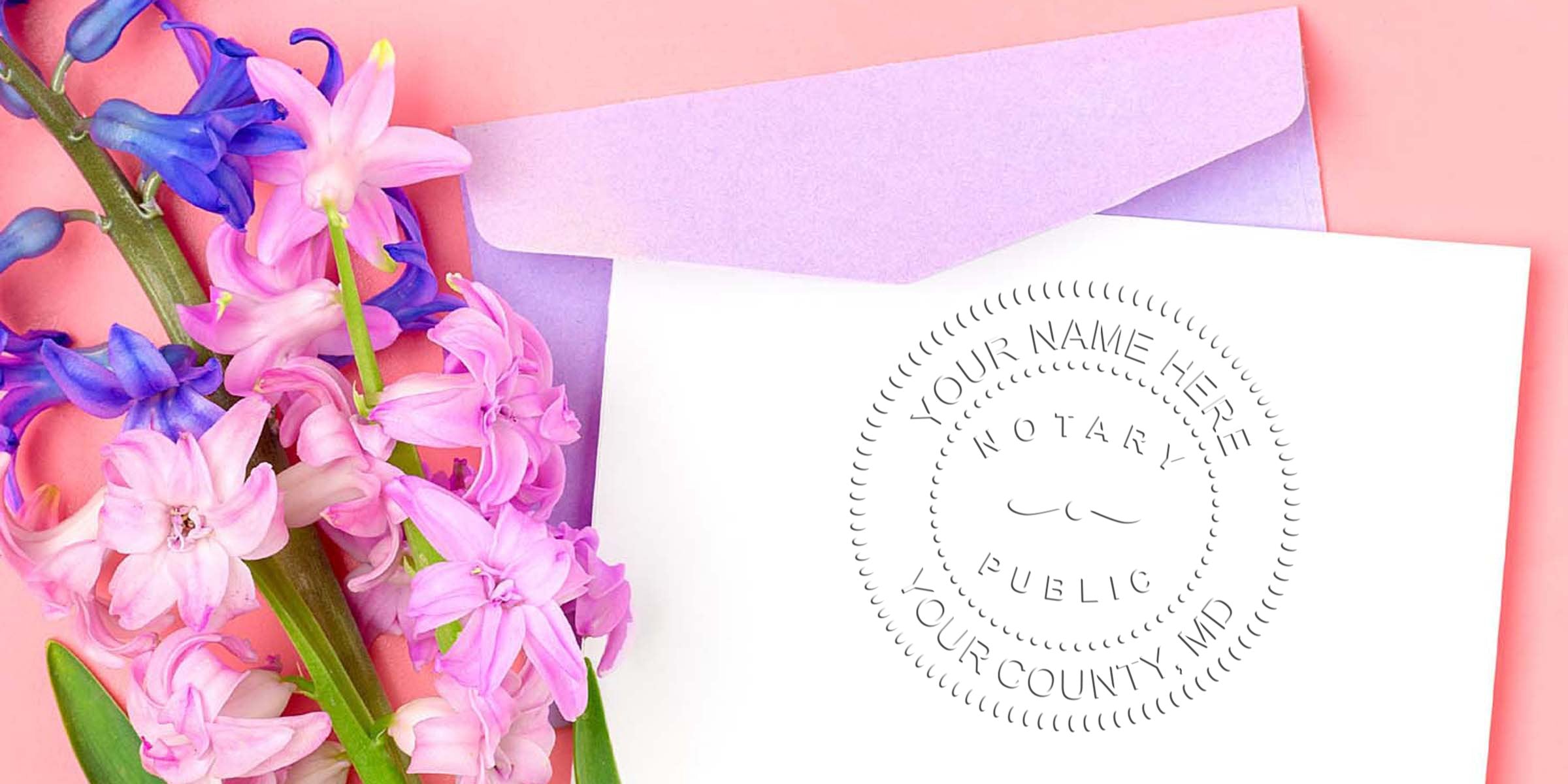 Maryland notary seal on white paper next to a purple envelope and pink-purple hyacinths on a pink background, illustrating a Maryland notary seal guide.