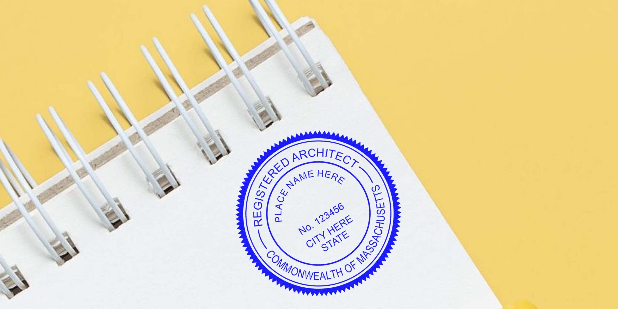Registered architect seal on white spiral notebook with yellow background, showing Massachusetts architect stamp cost and fees for license verification.