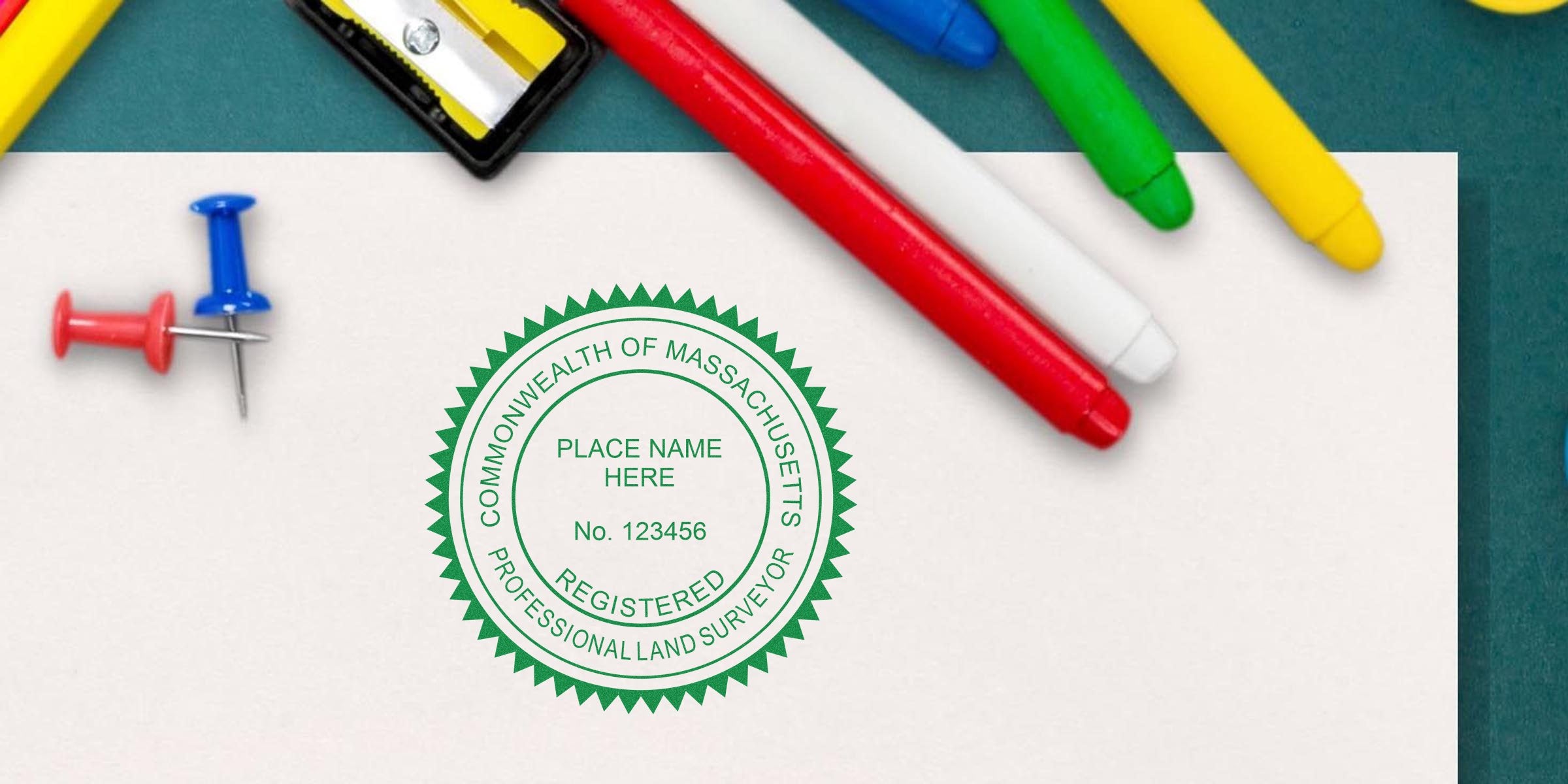 Massachusetts land surveyor stamp on paper with colorful markers and push pins, showcasing the value of the stamp for professional certification.