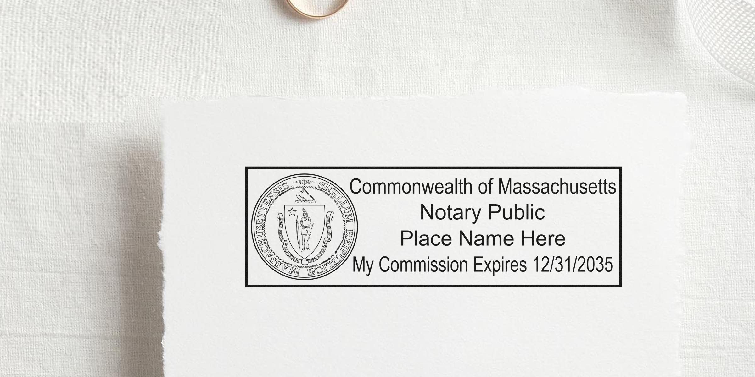 Massachusetts notary stamp with state seal and commission expiration date on white paper, created using a self-inking stamp.