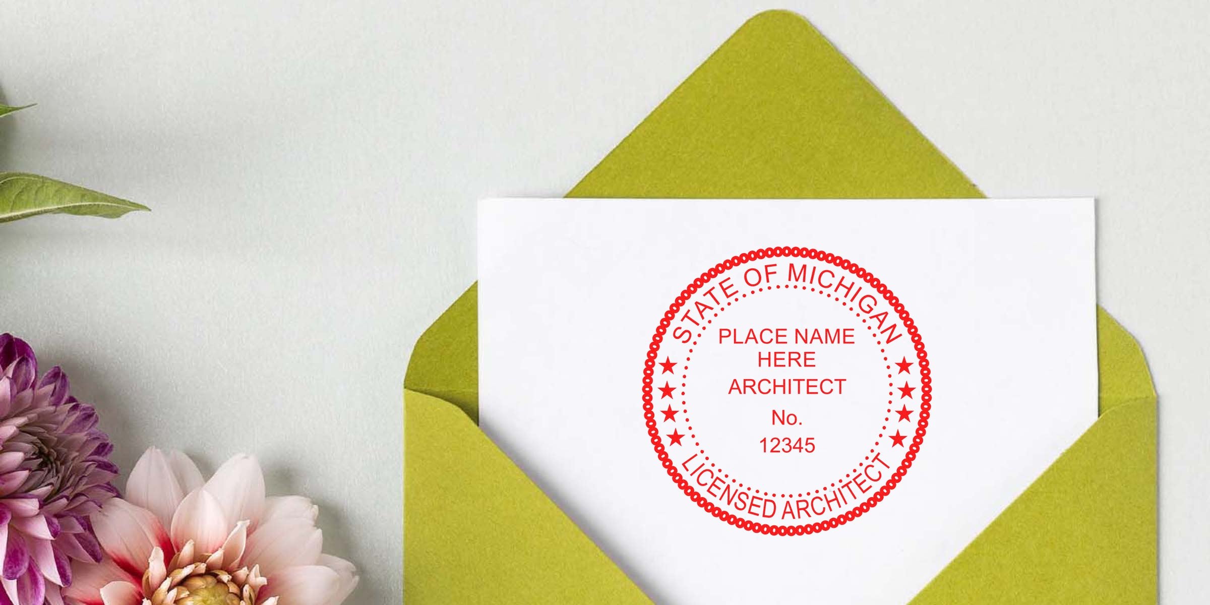 Michigan architect stamp on white paper inside a green envelope with flowers, highlighting architect stamp design tips.