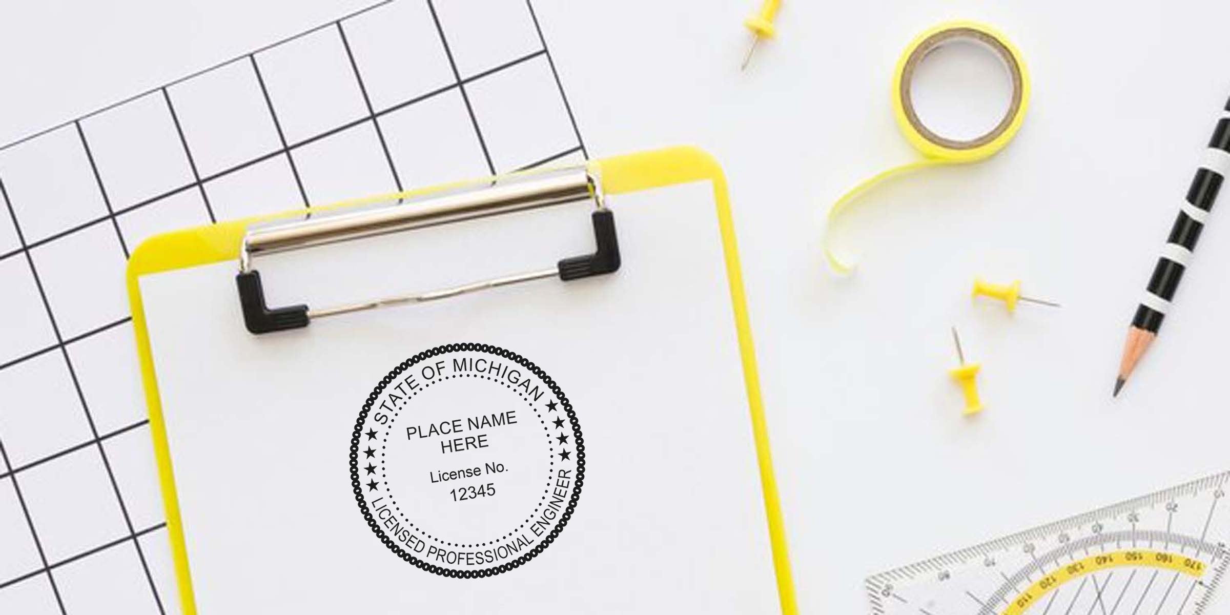 Yellow clipboard with Michigan Professional Engineer Stamps, surrounded by pencil, push pins, tape, and ruler on a white desk—perfect for buying Engineer Stamps Michigan.