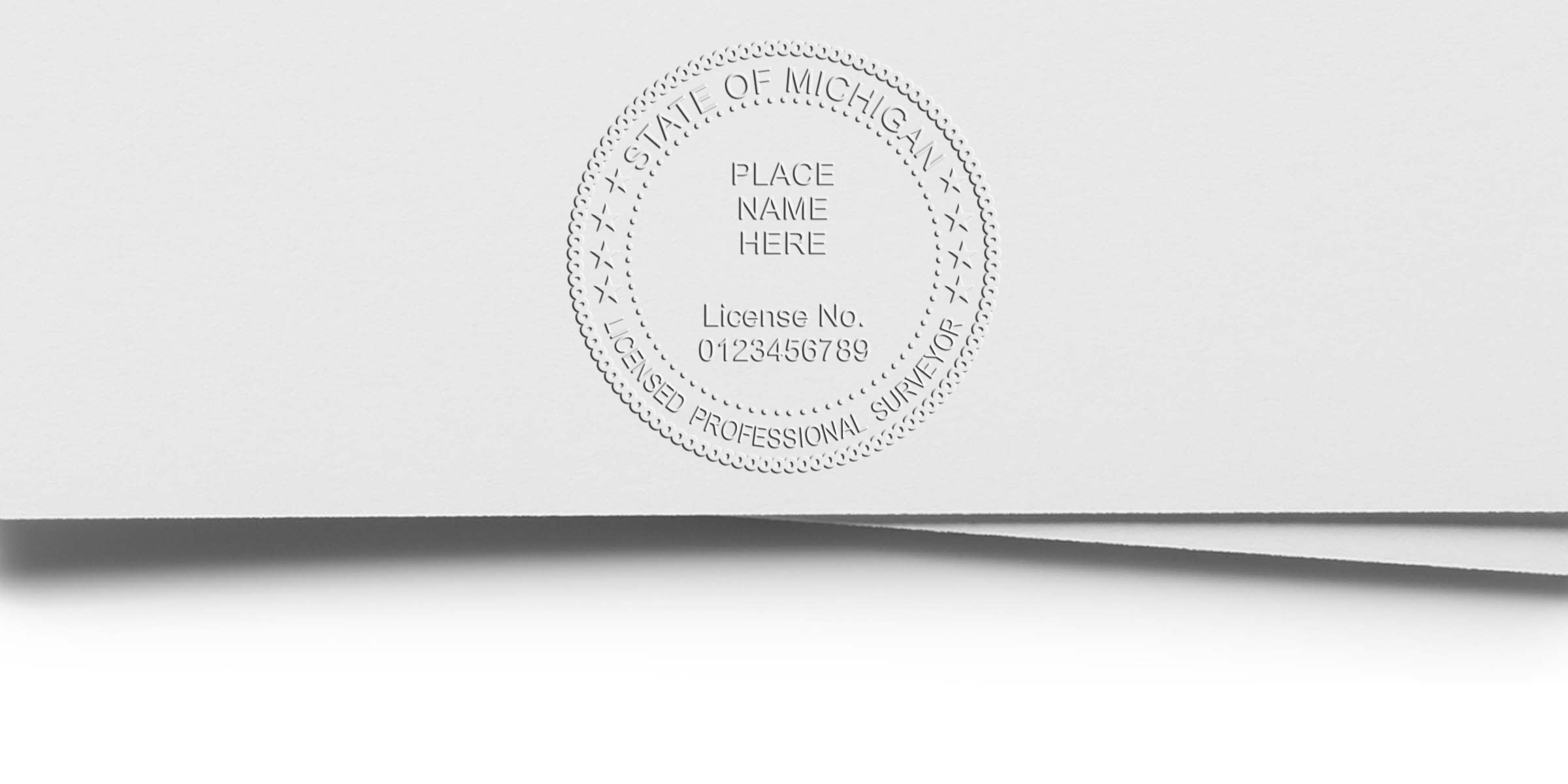 Michigan licensed professional surveyor embossed seal on white paper, featuring the Michigan surveyor seal with multiple embosser options.