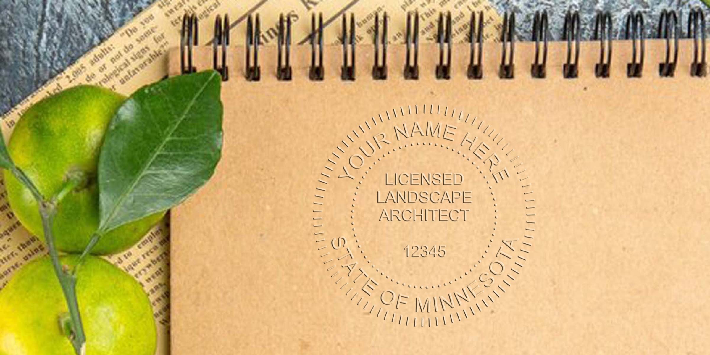 Minnesota landscape architect stamp on brown notebook with green leaves and newspaper, highlighting Minnesota landscape architect regulations.
