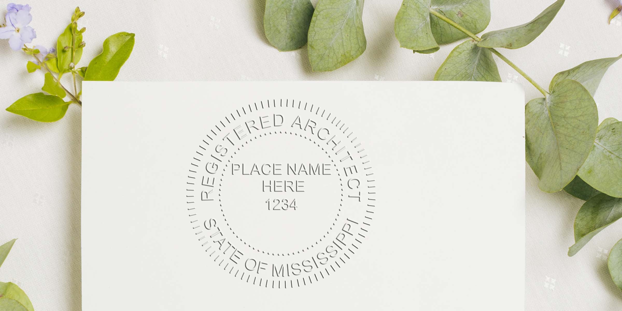 Registered Mississippi architect seal on white paper with green leaves, featuring the official Mississippi architect stamp meeting all stamp requirements.