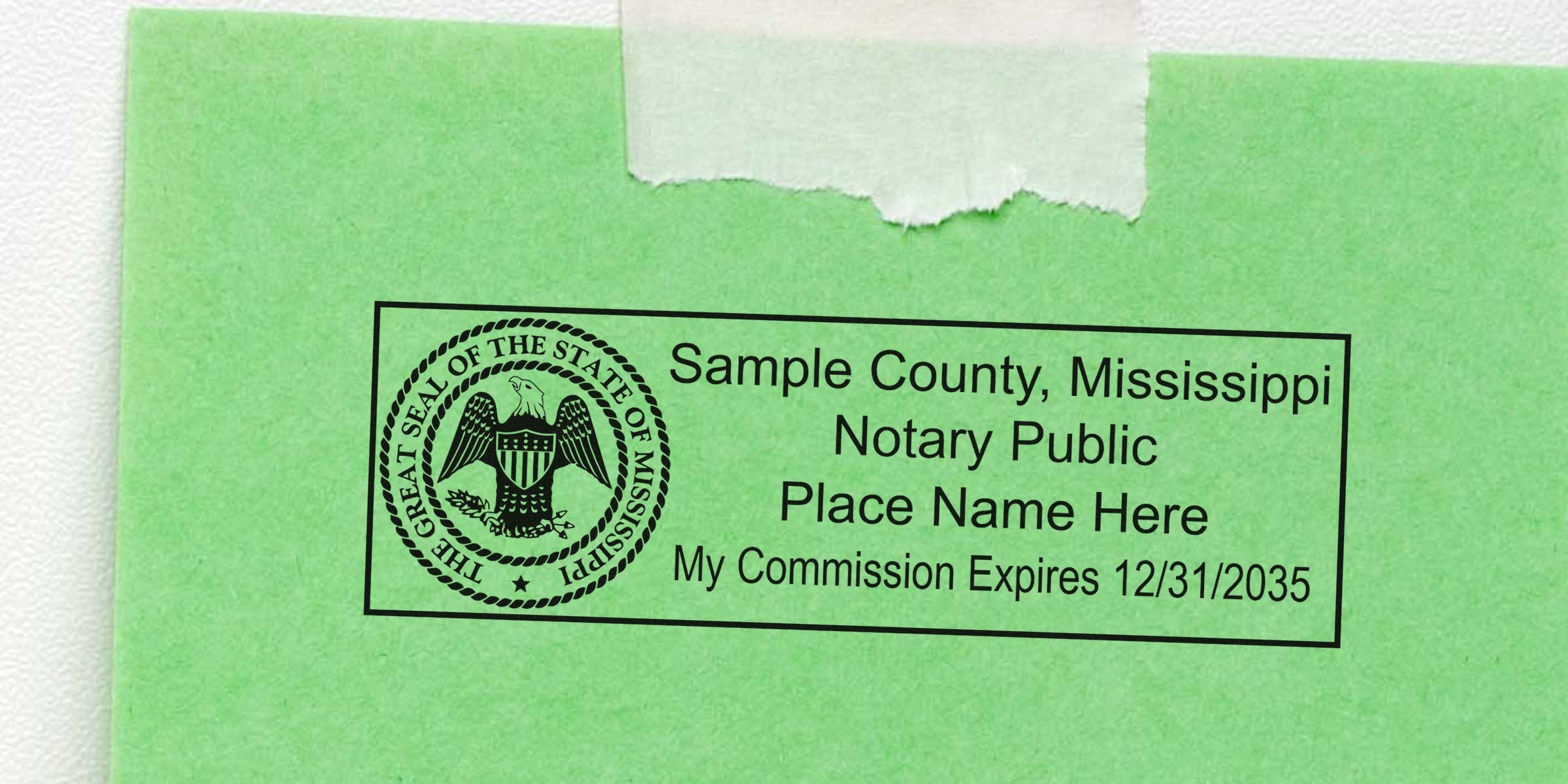 Best Notary Stamp Mississippi with a notary public stamp on green paper, displaying the state seal and commission expiration date.