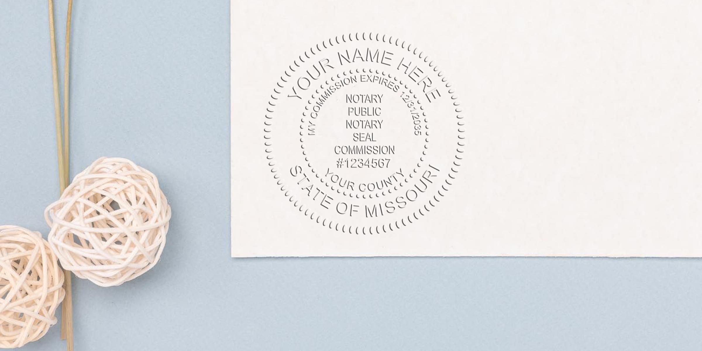 Missouri notary seal embossed on white paper with decorative wicker balls on a blue background, showing Notary Stamp Missouri and Missouri Notary Supplies.