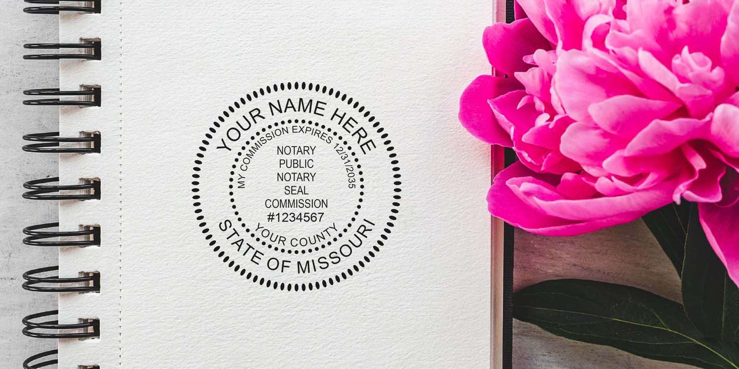 Missouri notary stamp on notebook page with pink flower, displaying Missouri notary public seal; purchase notary stamp online.