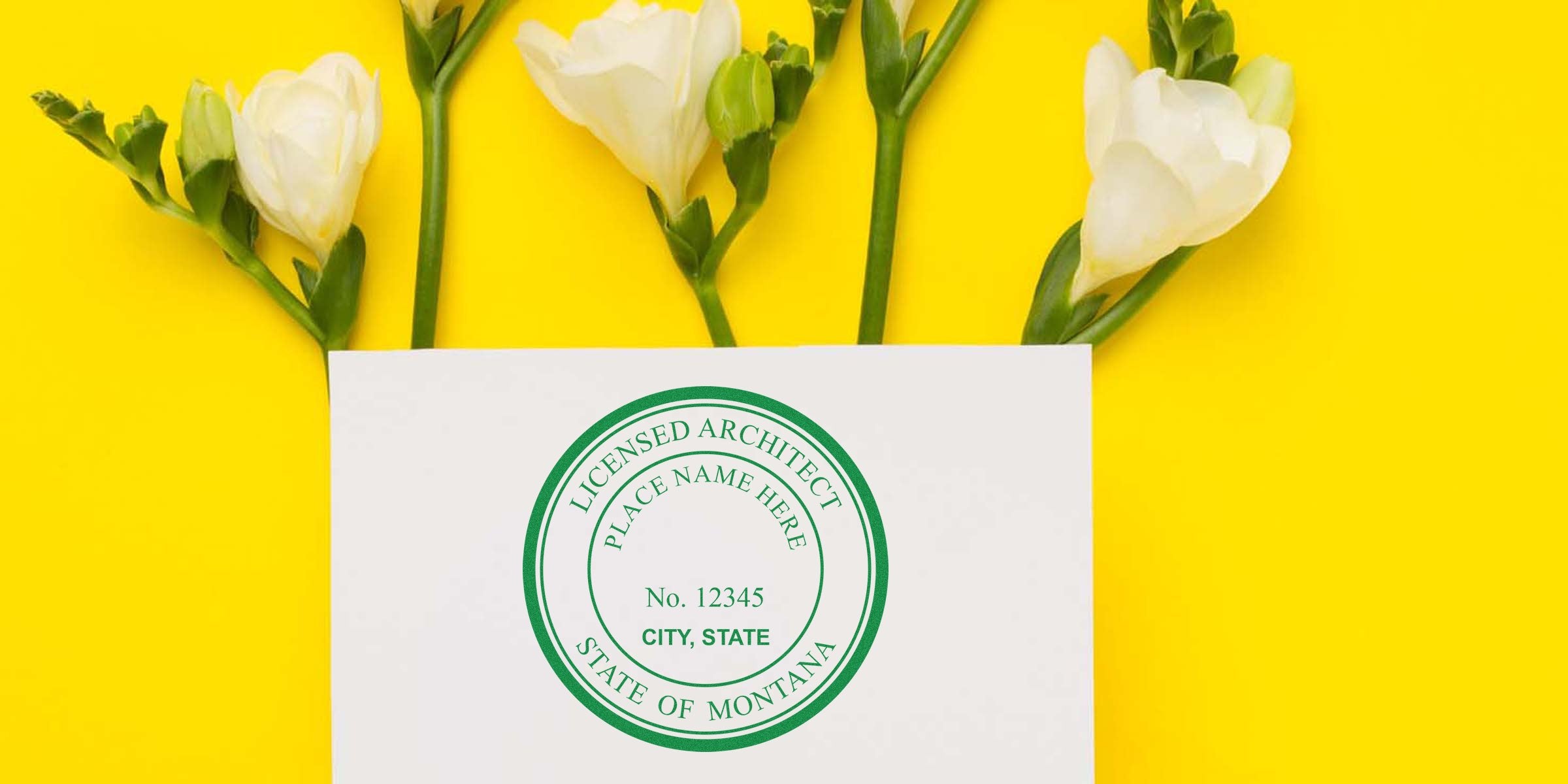 Montana licensed architect seal on white card with white flowers and yellow background, displaying Montana architect license.