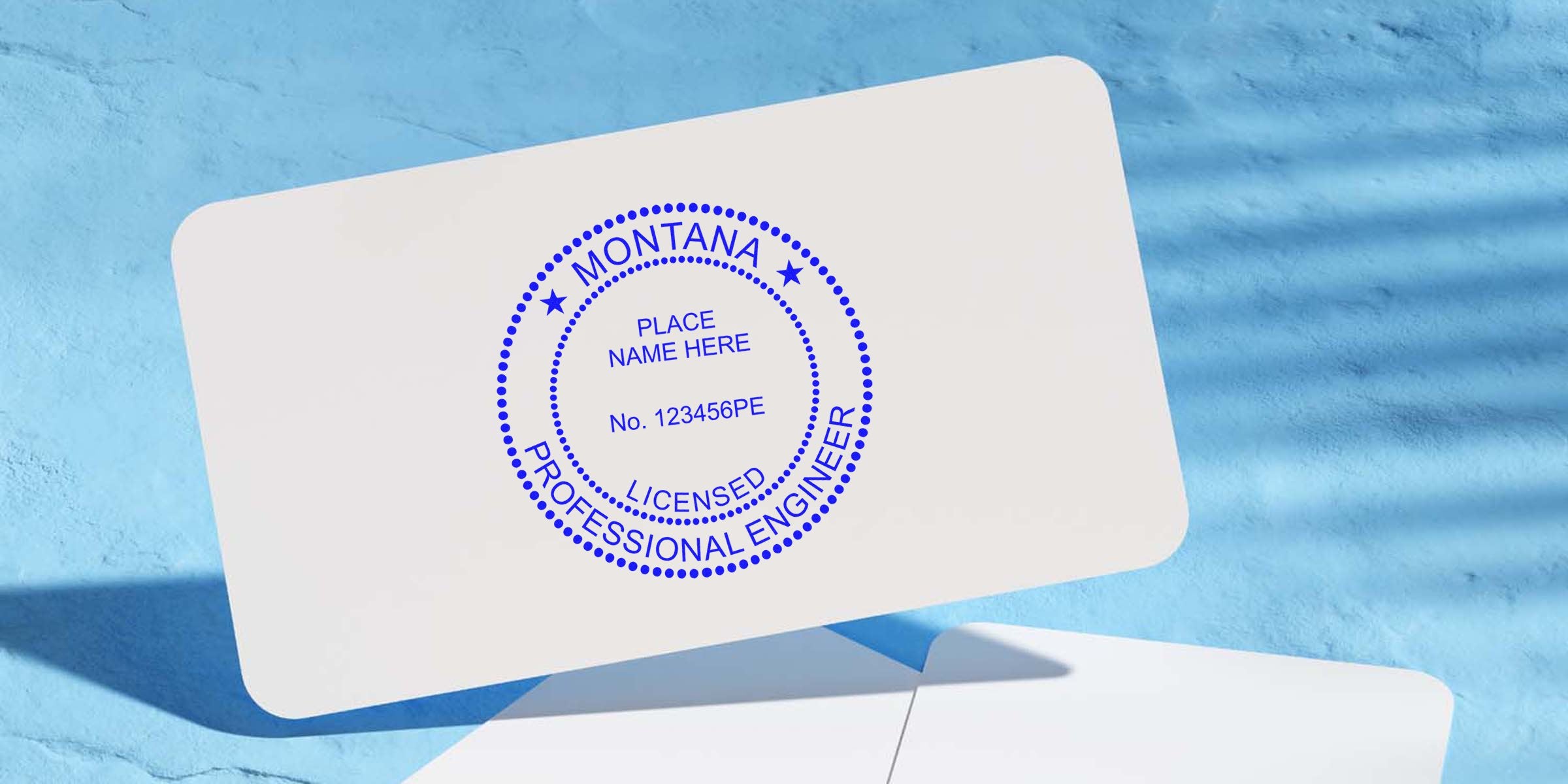 Montana licensed professional engineer stamp on white card with blue background, showing Montana PE stamp laws and engineer stamp regulations.