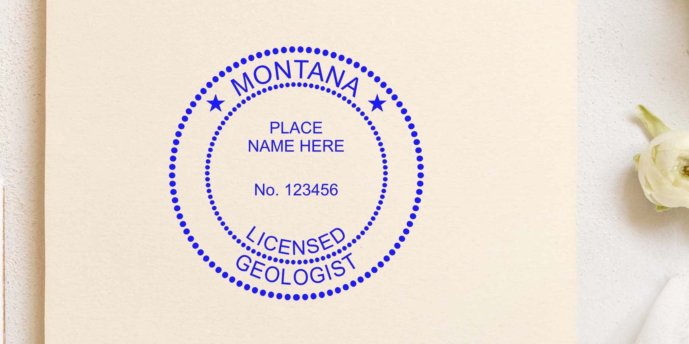 Montana licensed geologist custom seal on beige paper, showing place name, license number, and professional geology tools.