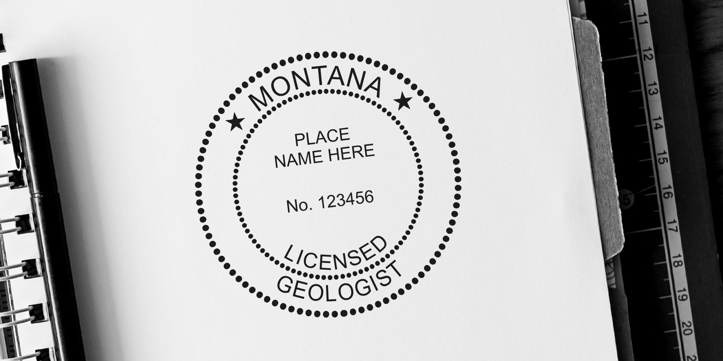 Rare Montana licensed geologist seal stamped on white paper, with a black pen and ruler, showcasing a collector's geologist seal.
