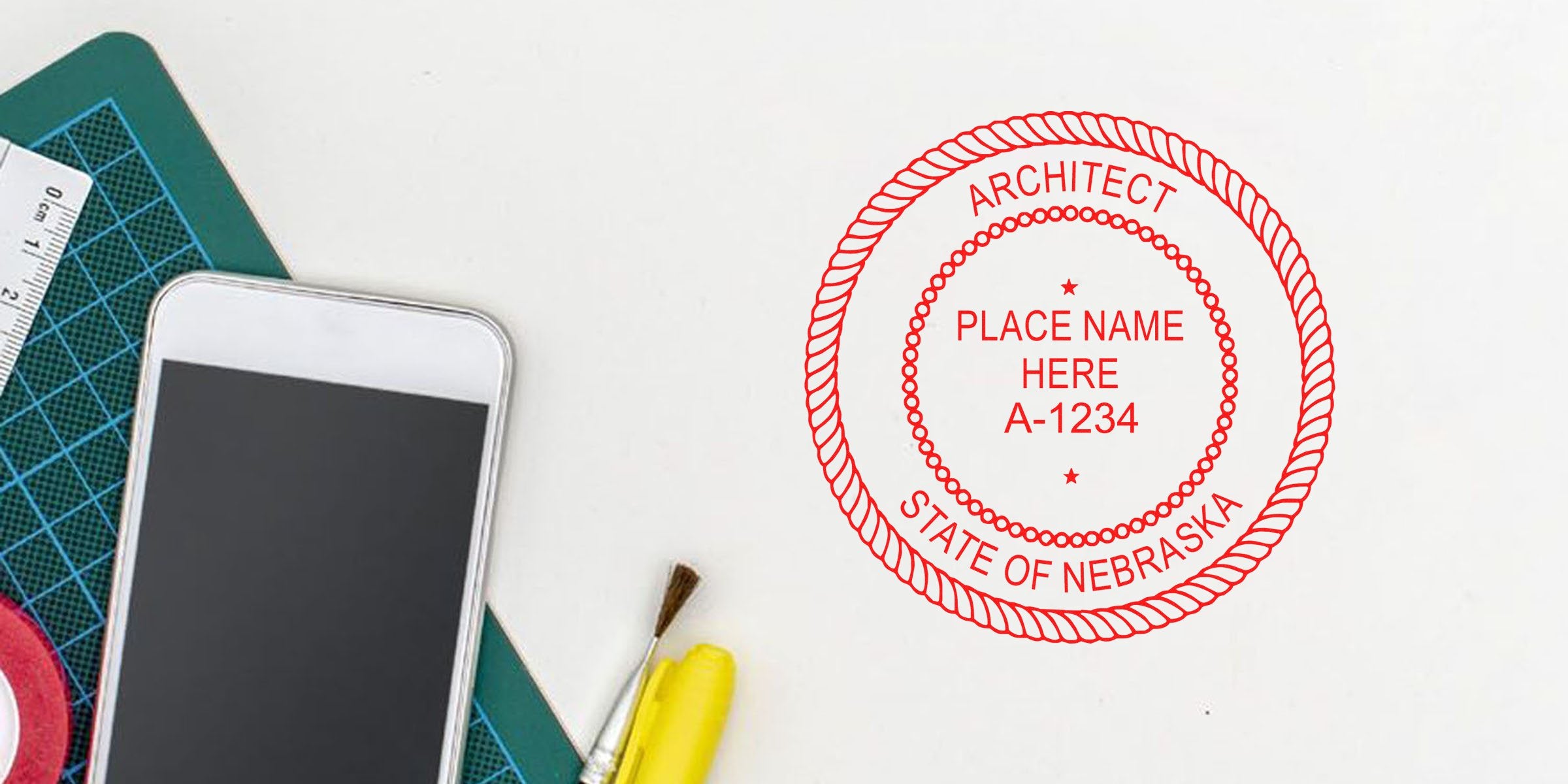 Nebraska architect stamp design with drafting tools and smartphone on white desk, showing architect stamp requirements for license verification.