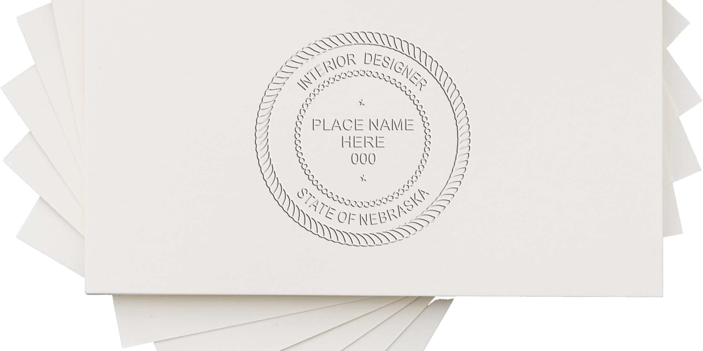 Embossed business cards for Nebraska interior designers with a custom Nebraska designer stamp and interior design licensing seal.