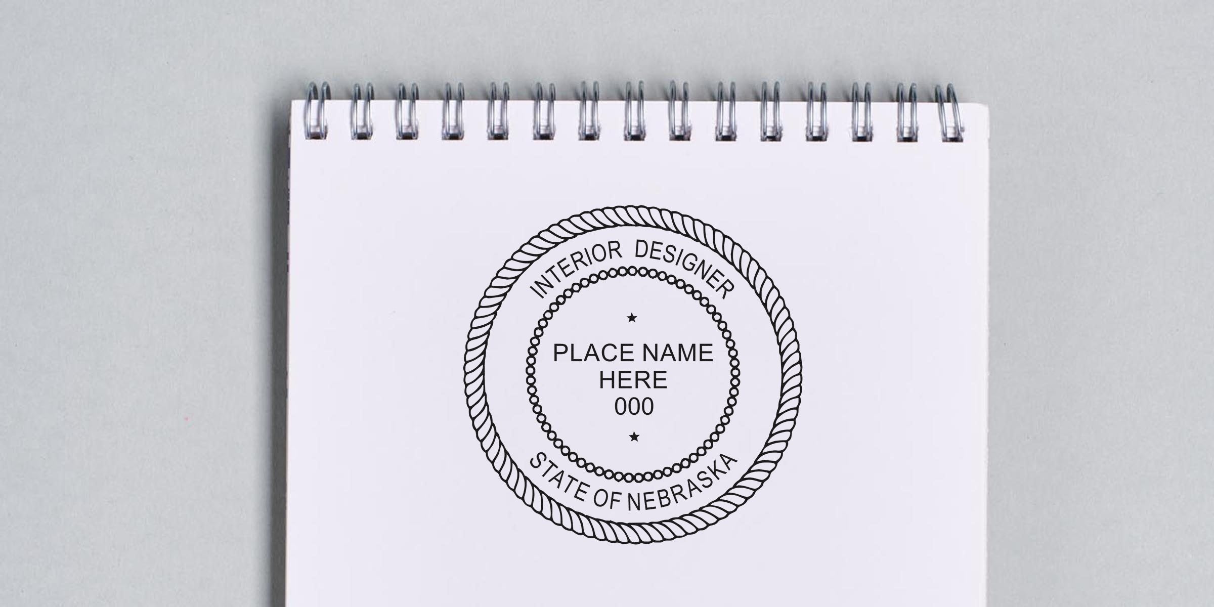 Nebraska Interior Designer Seal stamped on a spiral notebook, symbolizing Interior Design Certification in Nebraska.