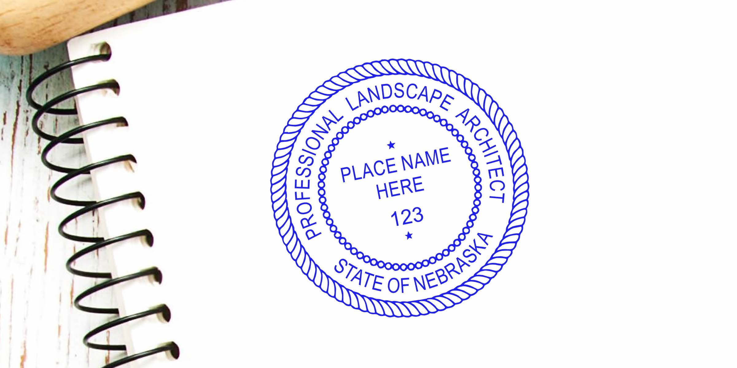 Nebraska Landscape Architect Seal stamped on a spiral notebook, symbolizing certification for landscape architects in Nebraska.